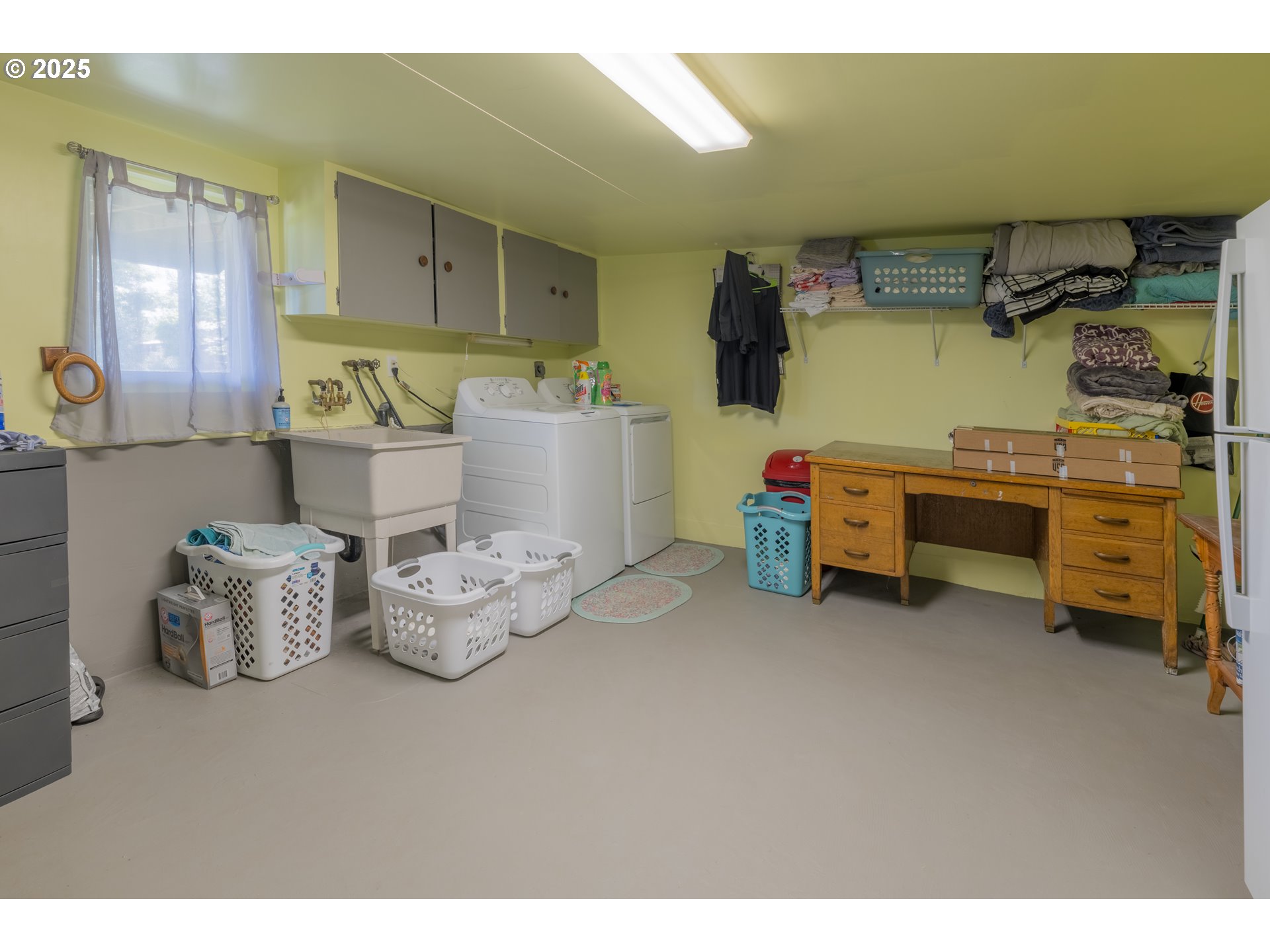 90431 Lewis Road Warrenton, OR 97146 - Photo 12 of 26 a kitchen with stainless steel appliances lots of white furniture