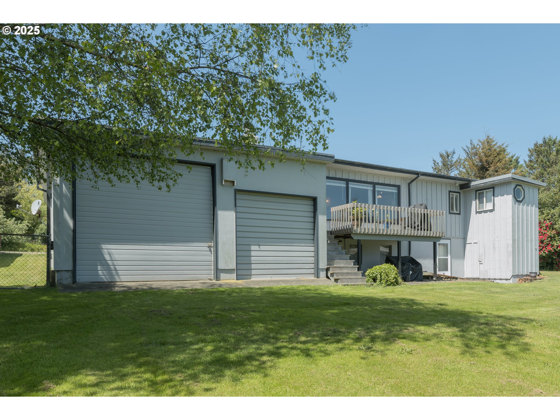 90431 Lewis Road Warrenton, OR 97146 - Photo 18 of 26 a front view of a house with a yard