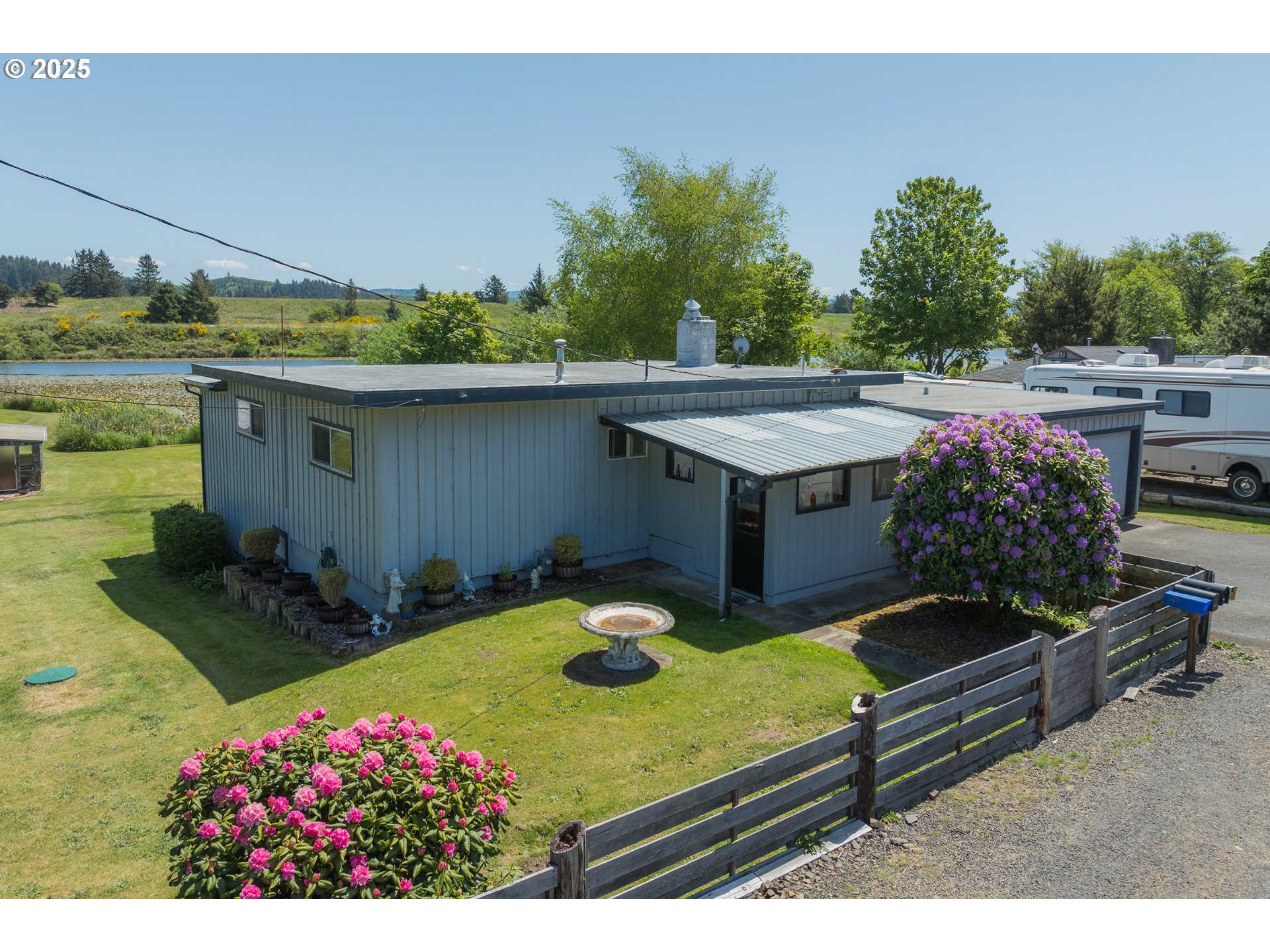 90431 Lewis Road Warrenton, OR 97146 - Photo 2 of 26 a view of a backyard with sitting area