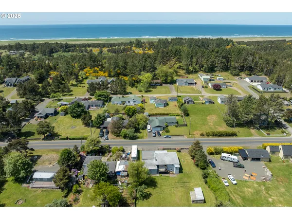 an aerial view of residential house with outdoor space and parking