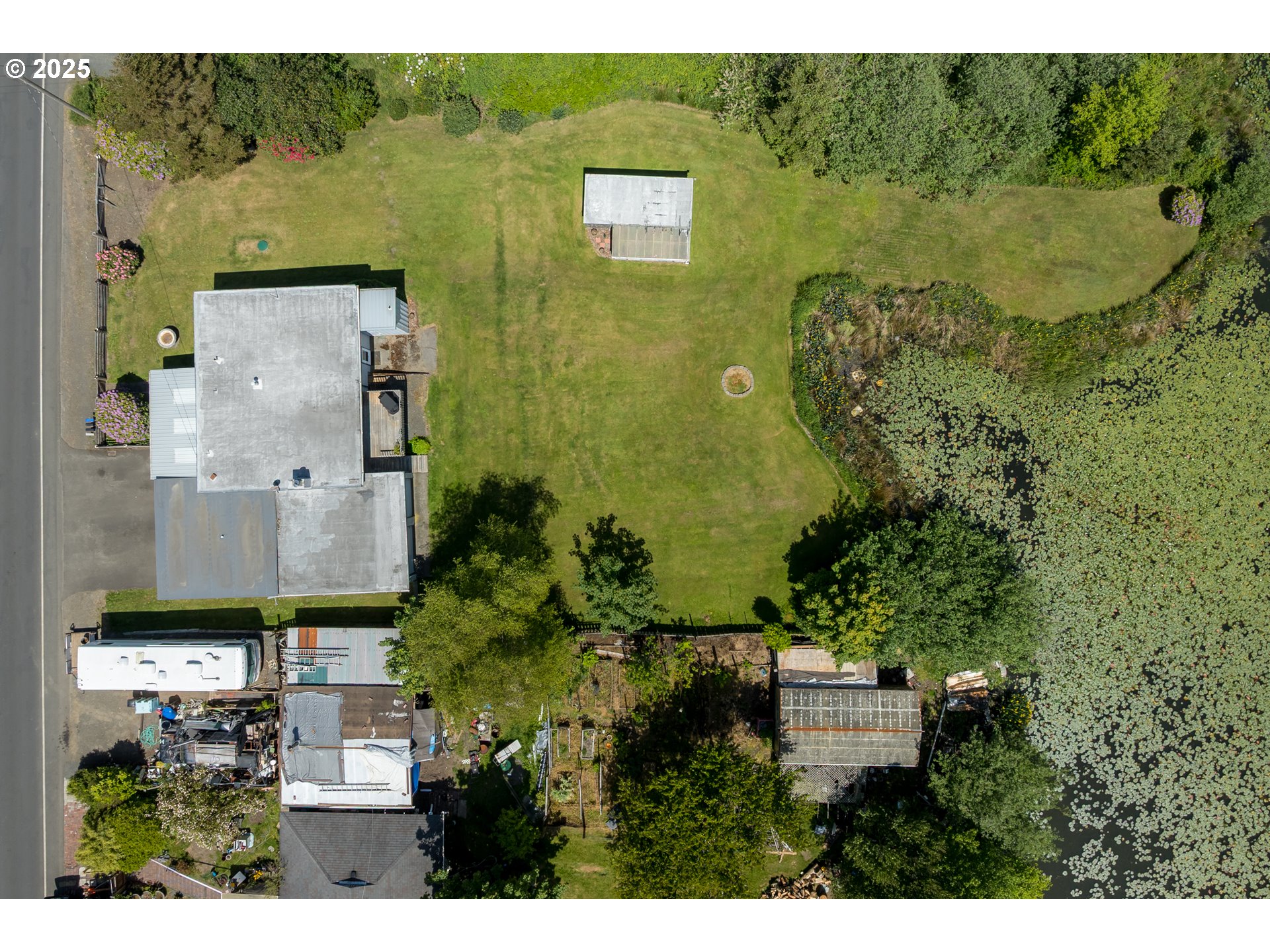 90431 Lewis Road Warrenton, OR 97146 - Photo 26 of 26 an aerial view of residential house with outdoor space and parking