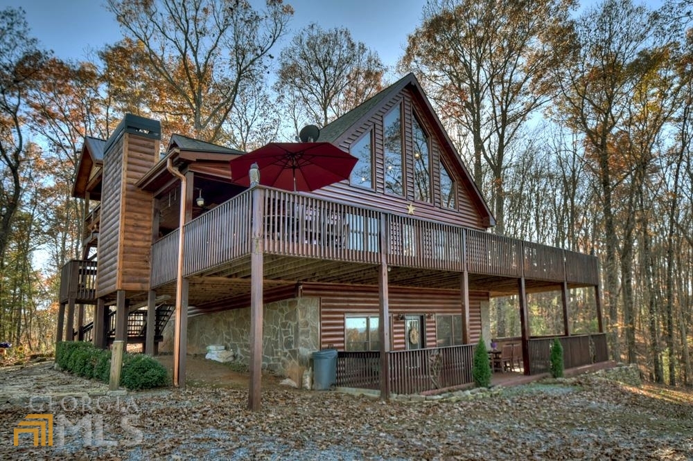 253 Cohutta Overlook Trail Blue Ridge, GA 30513 - Photo 1 of 1 a view of a house with a yard