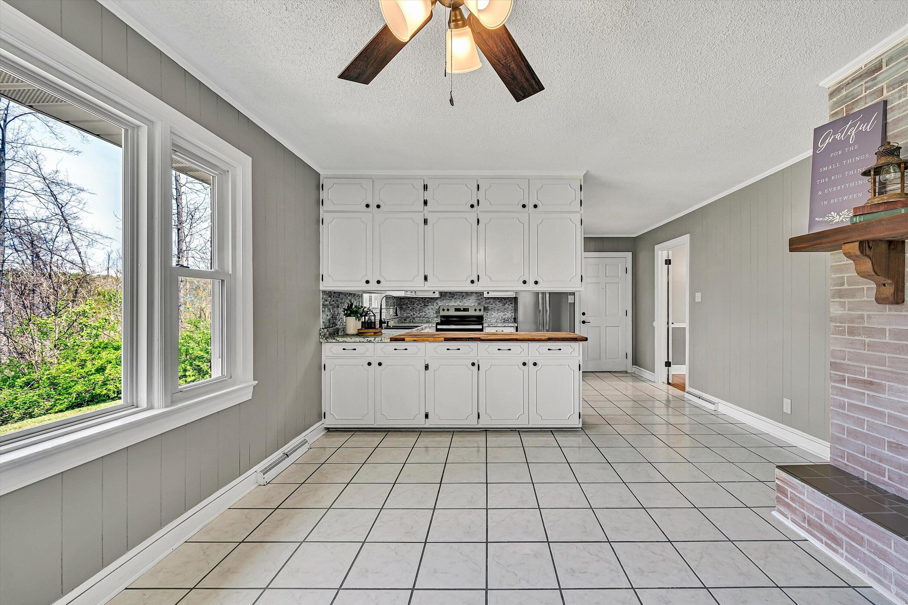 731 Bassett Heights Road Bassett, VA 24055 - Photo 10 of 45 a view of kitchen with stainless steel appliances cabinets and a large window