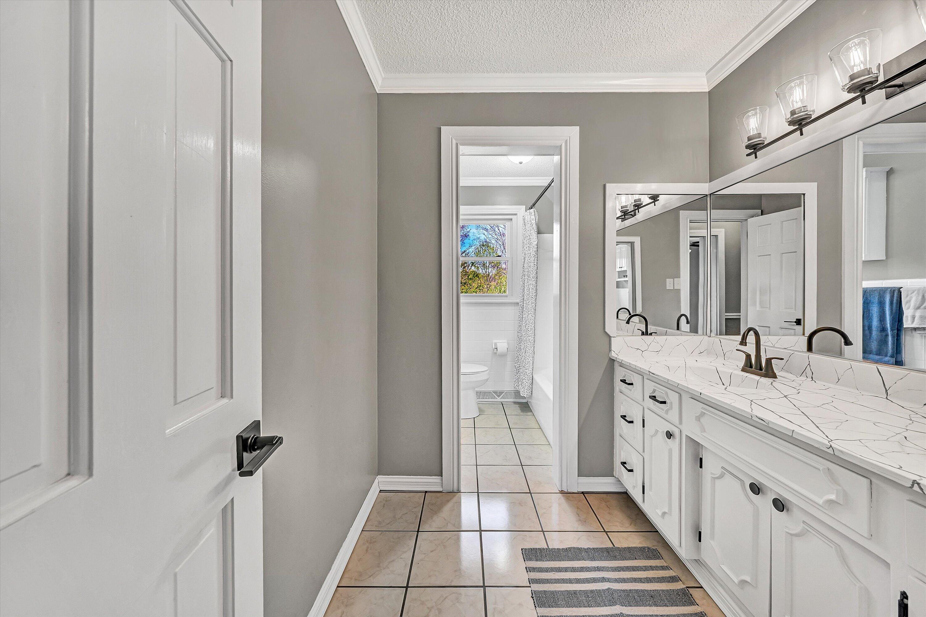 731 Bassett Heights Road Bassett, VA 24055 - Photo 12 of 45 a spacious bathroom with a double vanity sink a mirror and a shower