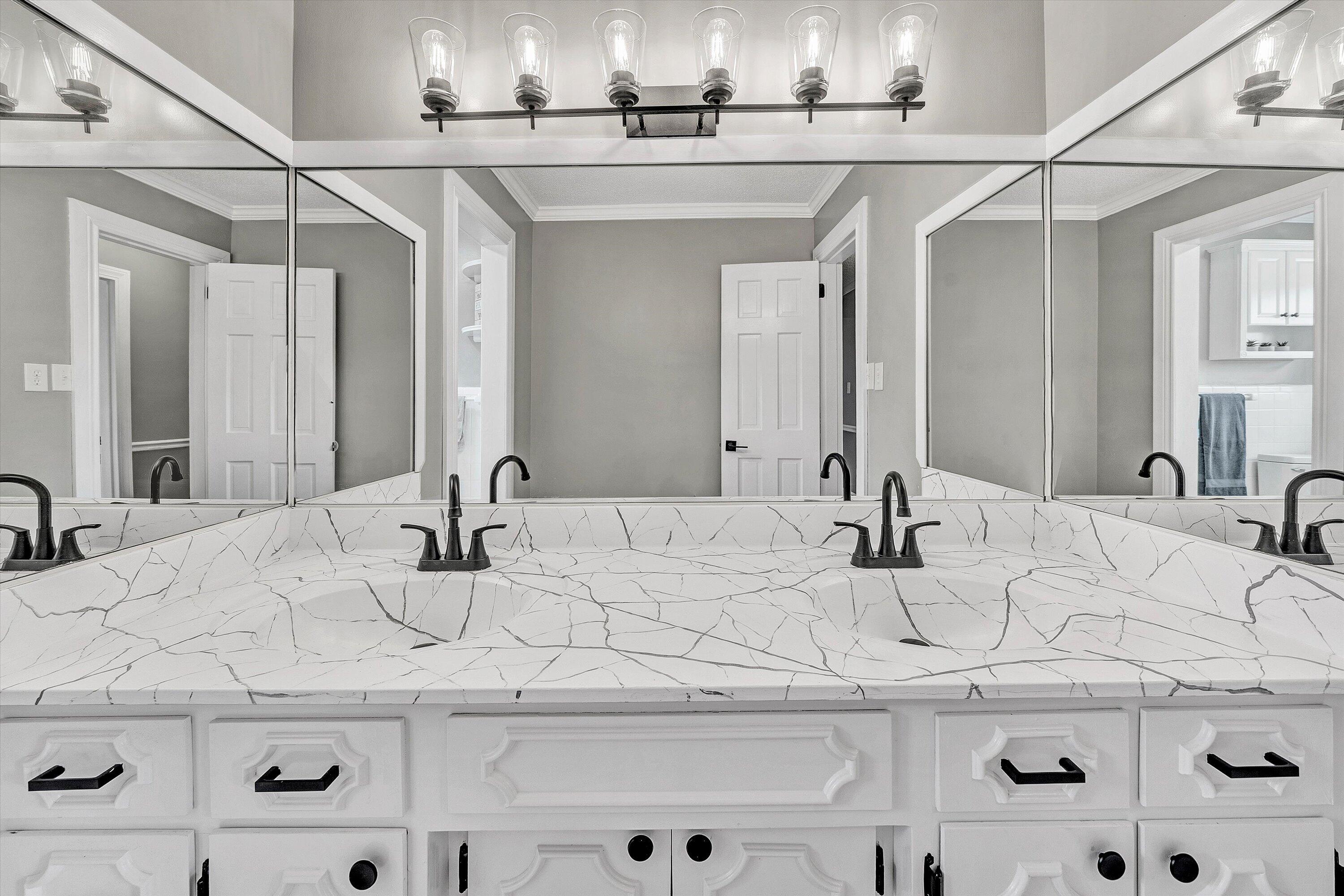 731 Bassett Heights Road Bassett, VA 24055 - Photo 13 of 45 a bathroom with double vanity sinks and a mirror