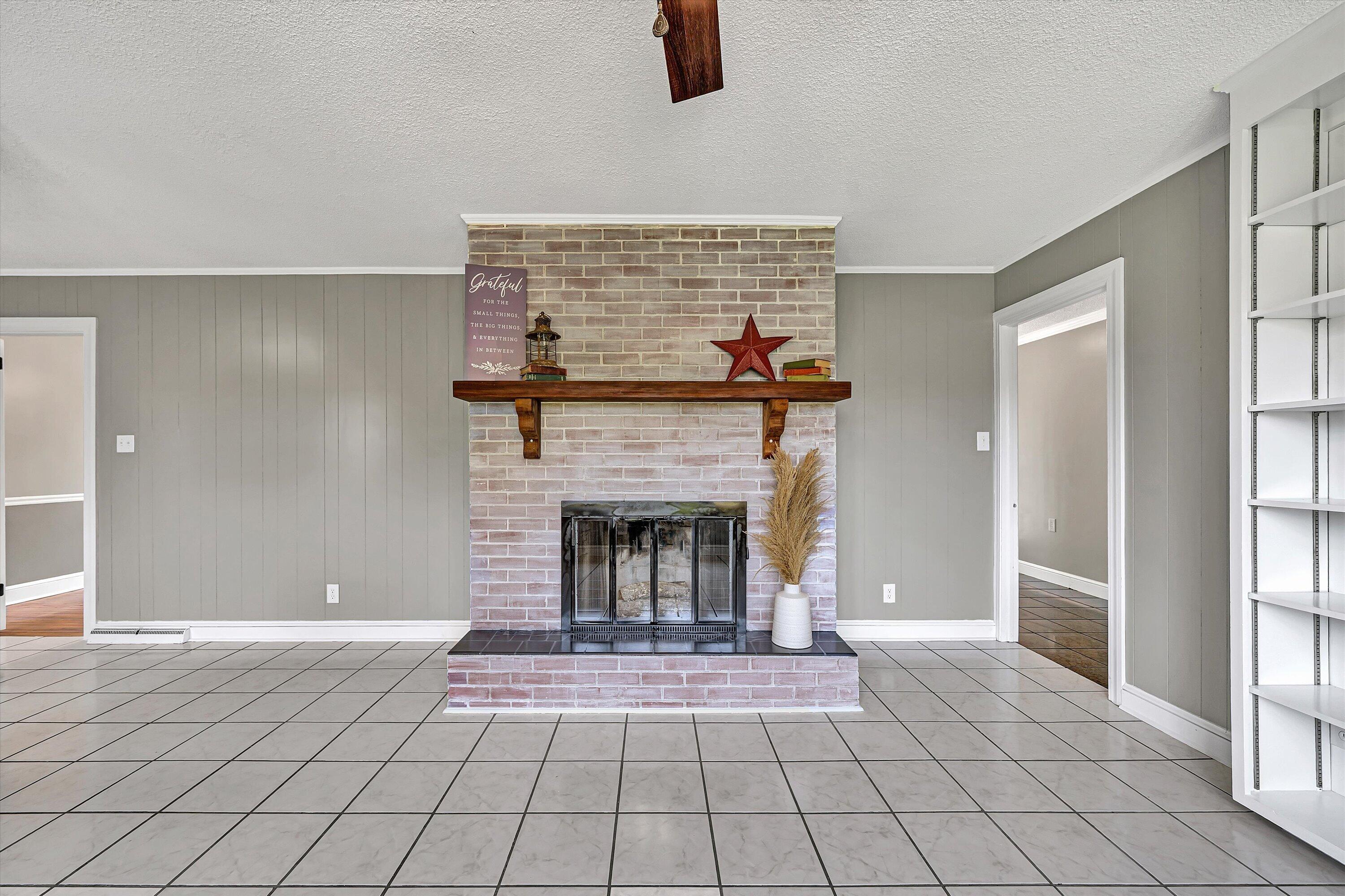 731 Bassett Heights Road Bassett, VA 24055 - Photo 18 of 45 a living room with furniture and a fireplace