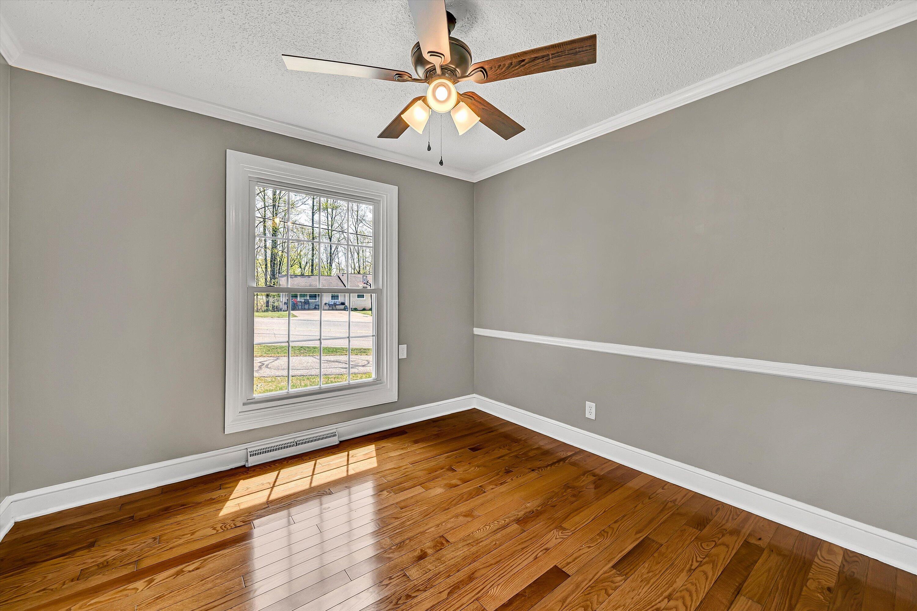 731 Bassett Heights Road Bassett, VA 24055 - Photo 21 of 45 wooden floor in an empty room with a window