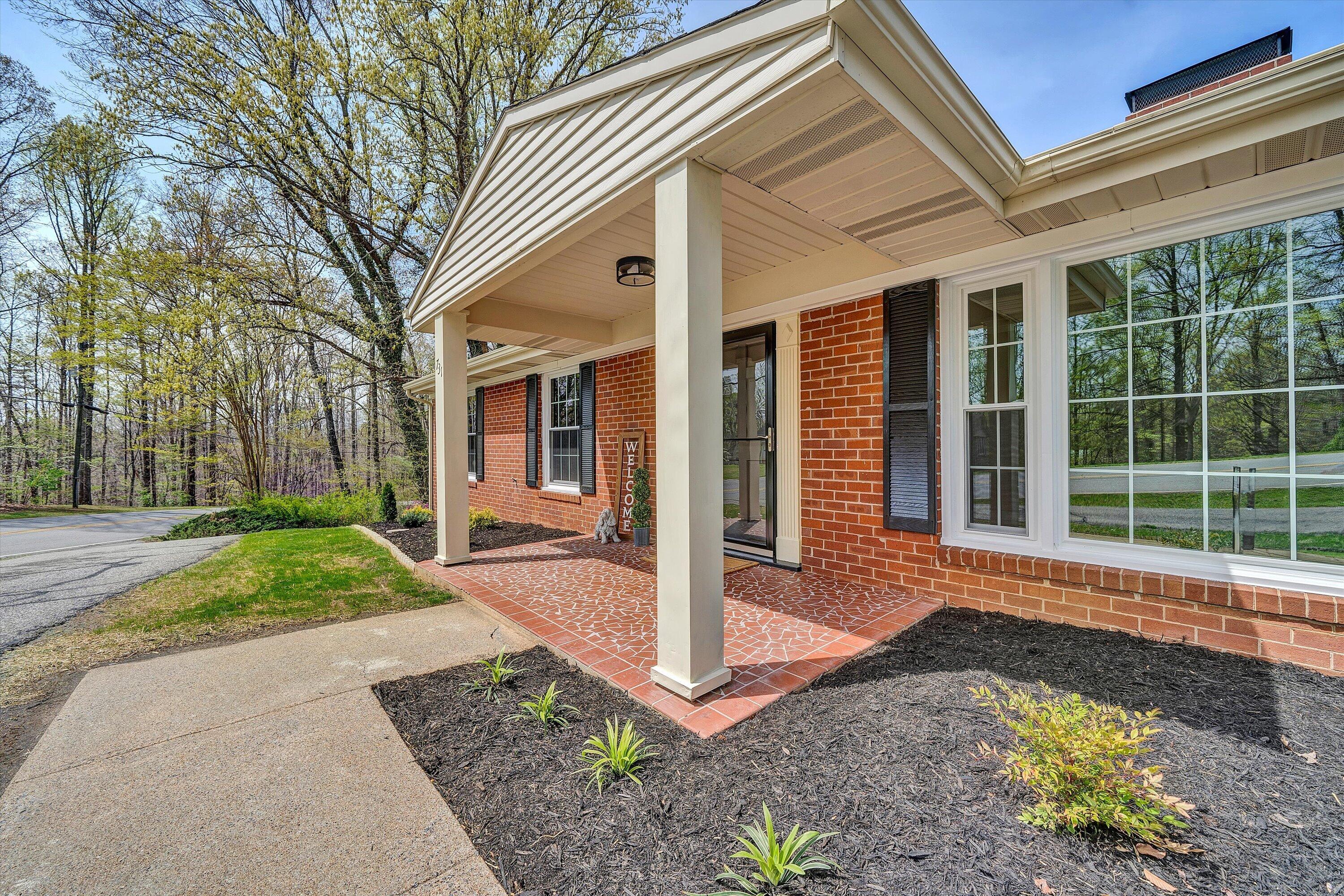 731 Bassett Heights Road Bassett, VA 24055 - Photo 3 of 45 a front view of a house with a yard