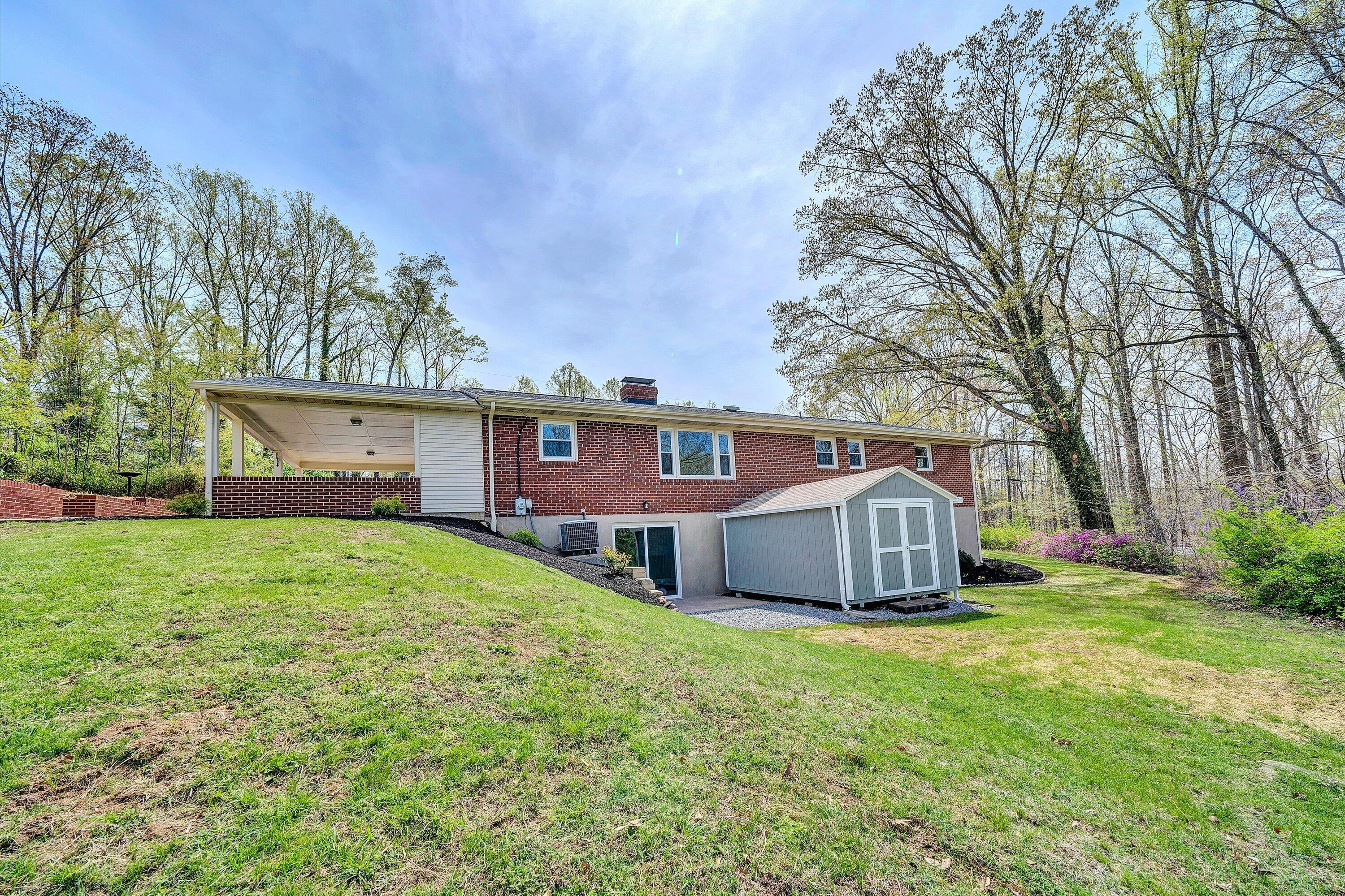 731 Bassett Heights Road Bassett, VA 24055 - Photo 44 of 45 front view of a house with a yard