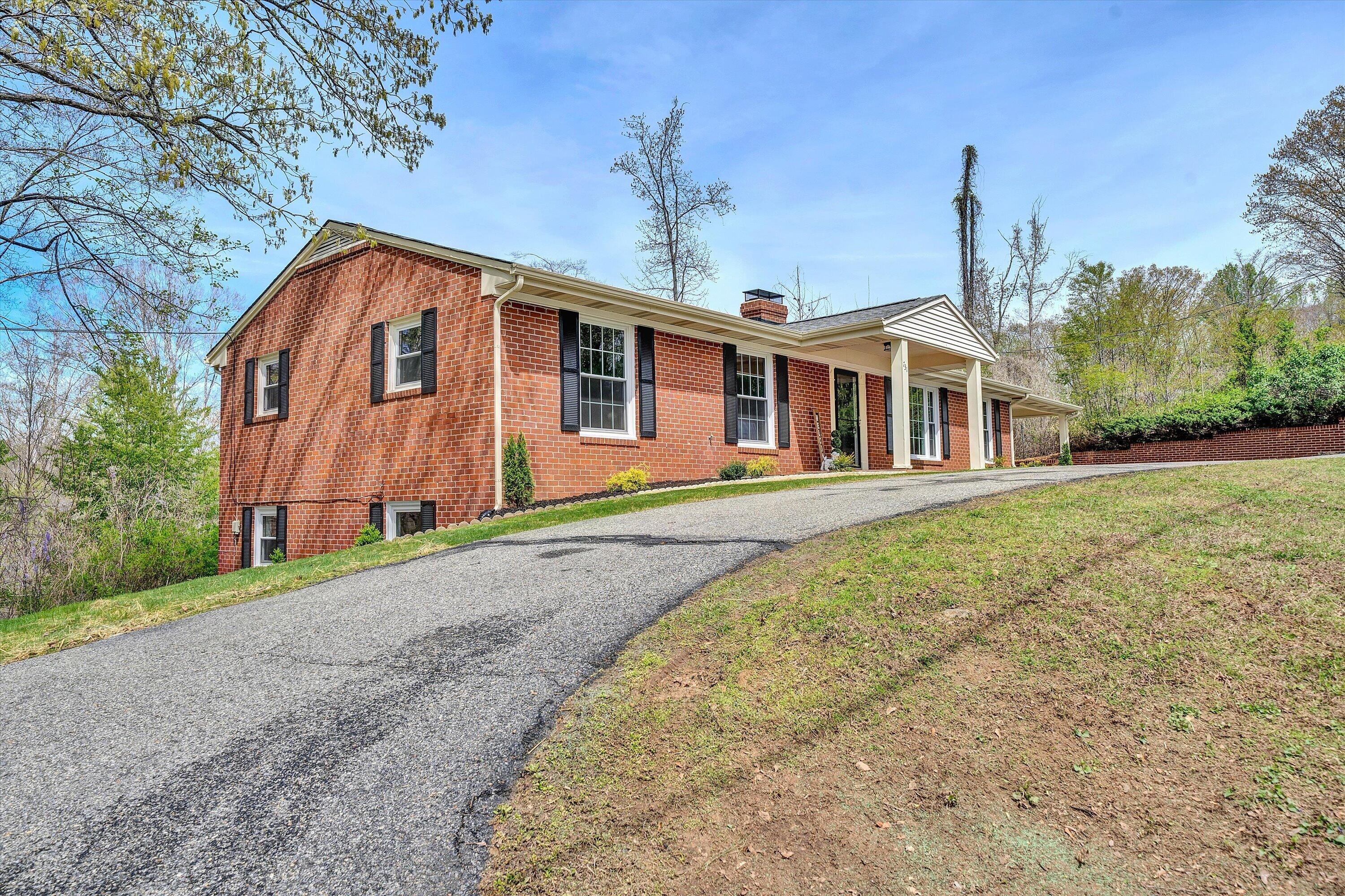 731 Bassett Heights Road Bassett, VA 24055 - Photo 4 of 45 front view of a house with a yard