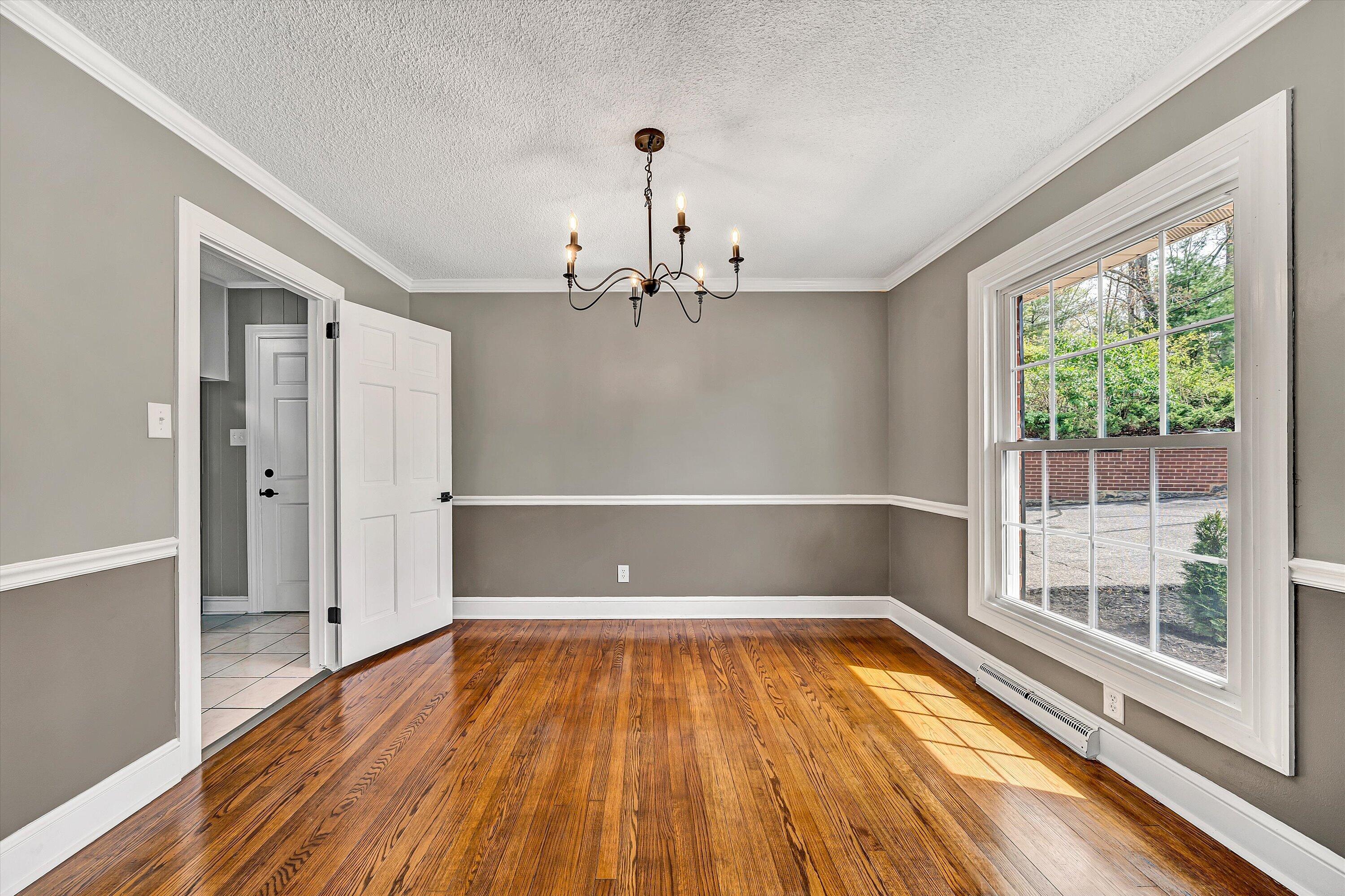 731 Bassett Heights Road Bassett, VA 24055 - Photo 7 of 45 wooden floor in an empty room with a window