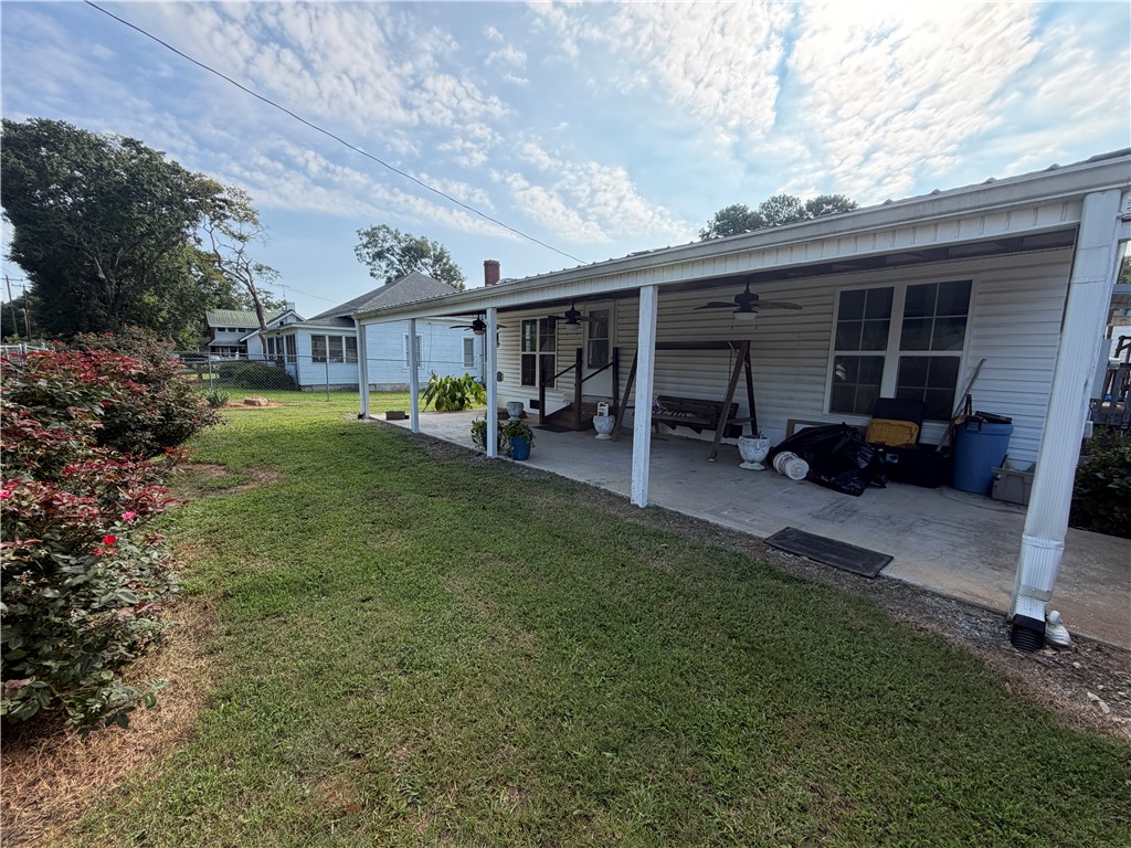 3211 South Main Street Anderson, SC 29624 - Photo 2 of 11 An inviting porch and lush green lawn create a pleasant outdoor retreat.
