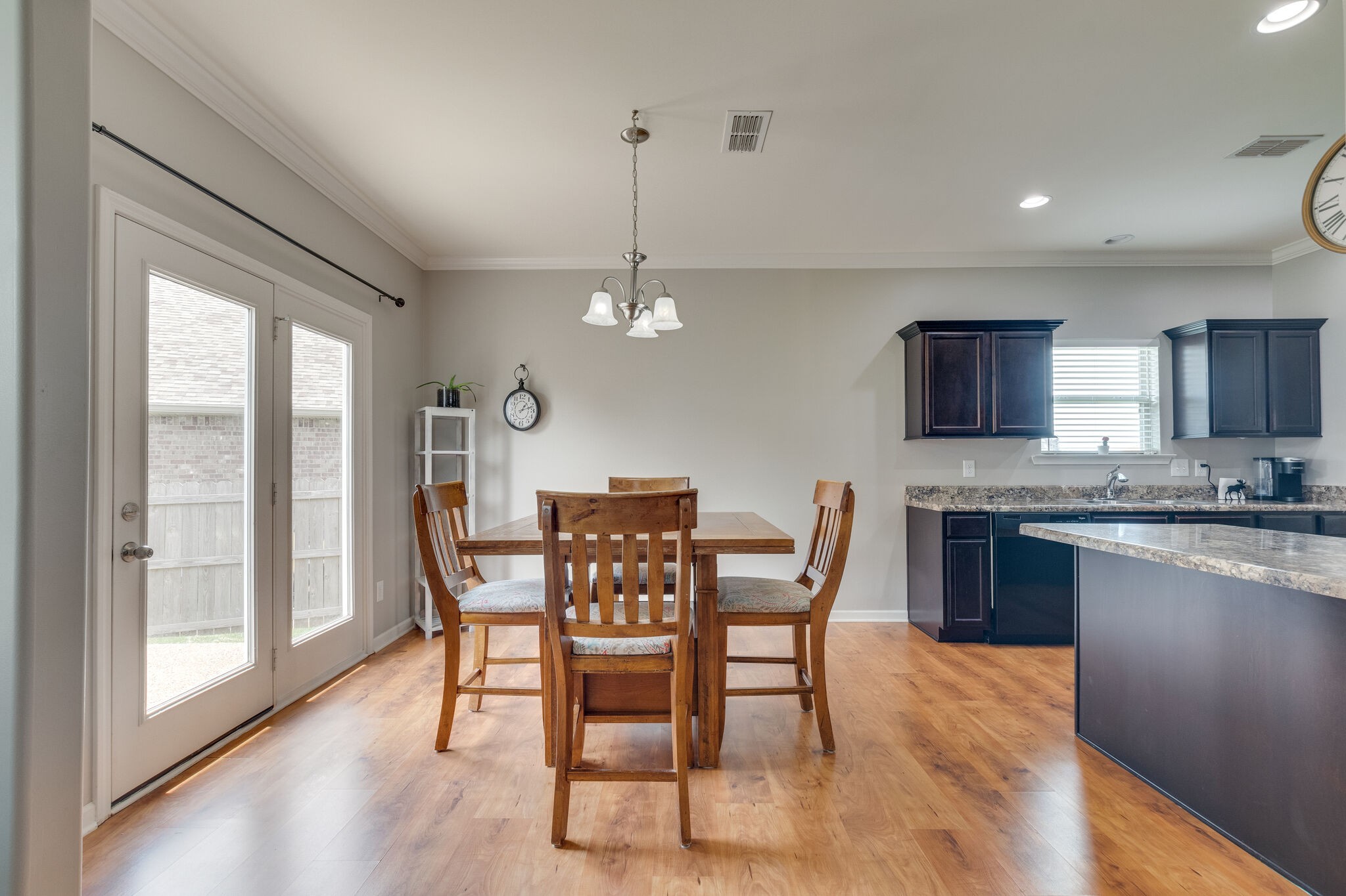 2018 Lincoln Road Spring Hill, TN 37174 - Photo 14 of 32 a dining room with furniture a chandelier and wooden floor