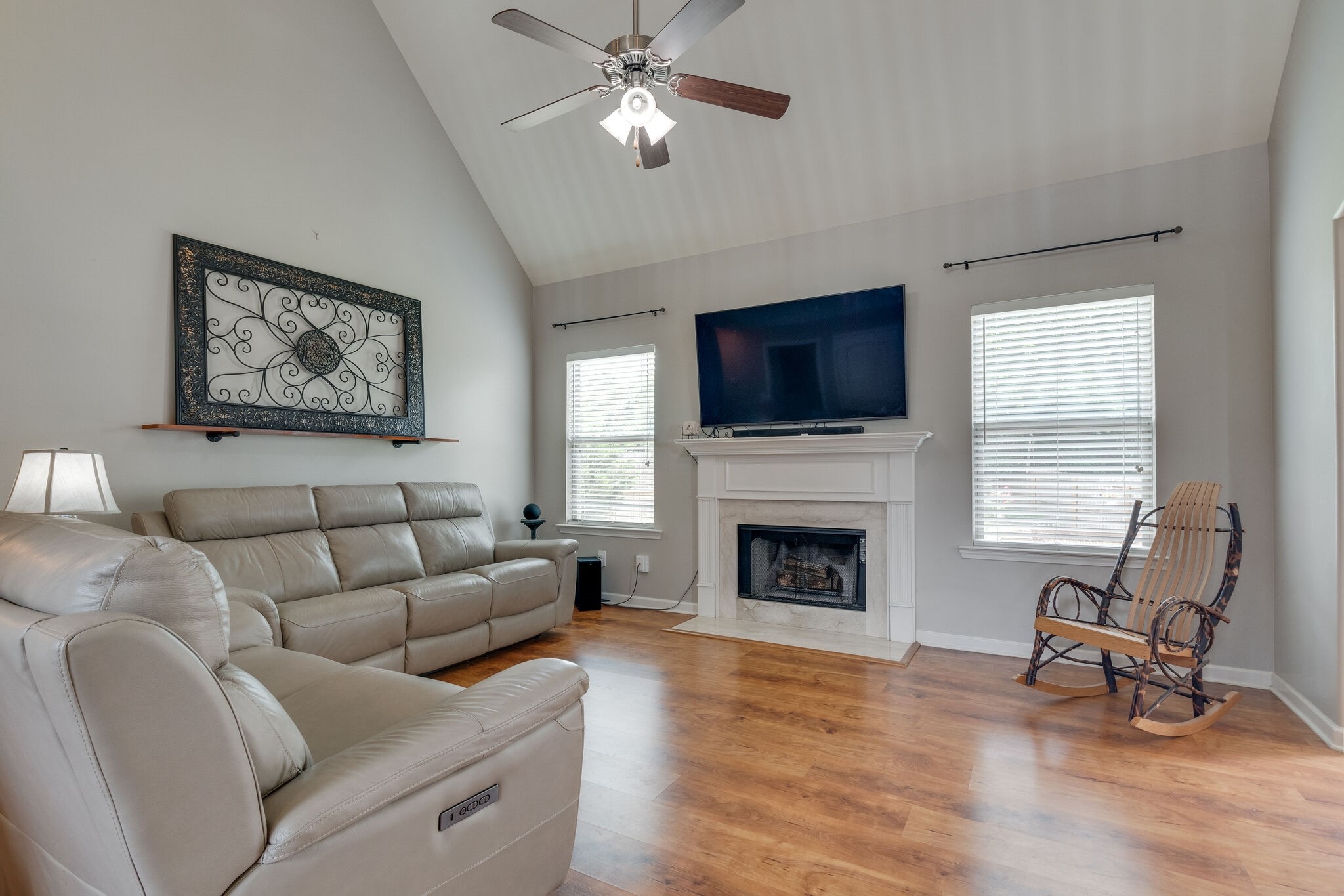 2018 Lincoln Road Spring Hill, TN 37174 - Photo 17 of 32 a living room with furniture a fireplace and a flat screen tv