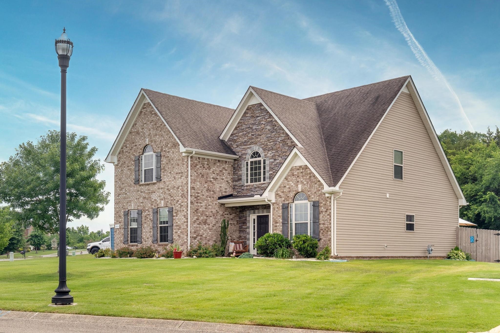 2018 Lincoln Road Spring Hill, TN 37174 - Photo 2 of 32 a front view of a house with a yard
