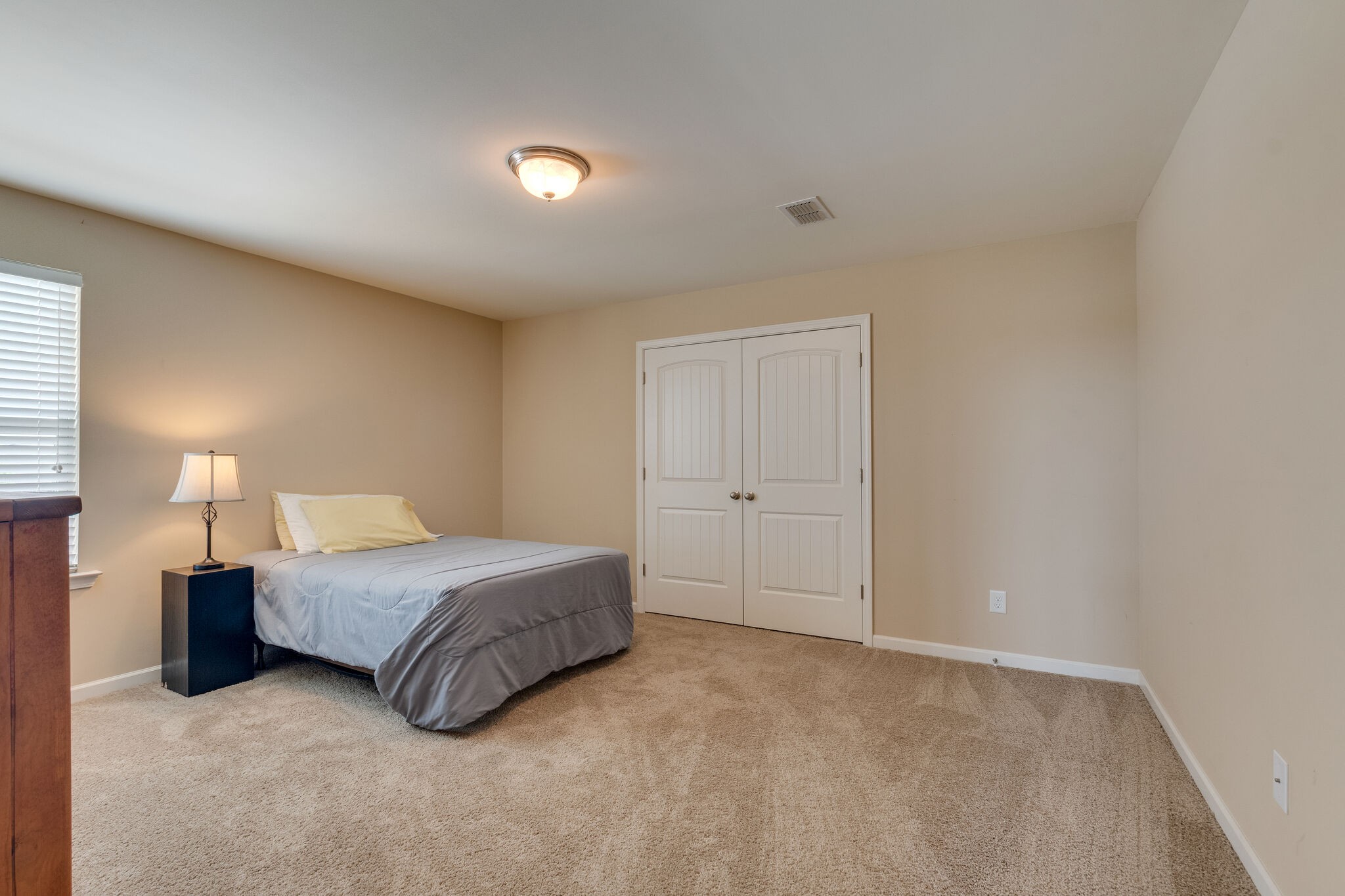 2018 Lincoln Road Spring Hill, TN 37174 - Photo 27 of 32 a spacious bedroom with a bed and a lamp