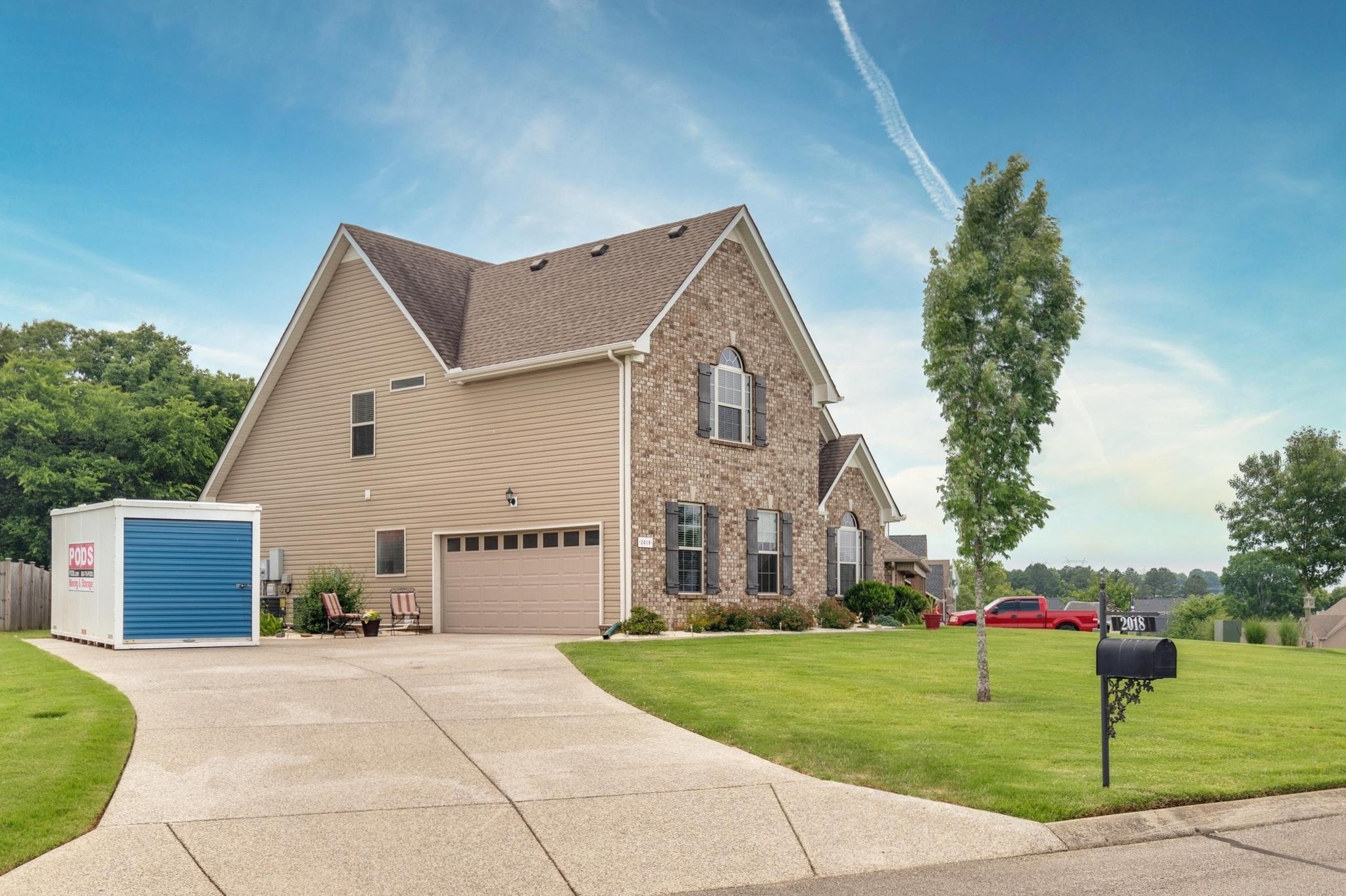 2018 Lincoln Road Spring Hill, TN 37174 - Photo 4 of 32 a view of a house with a yard and a garage