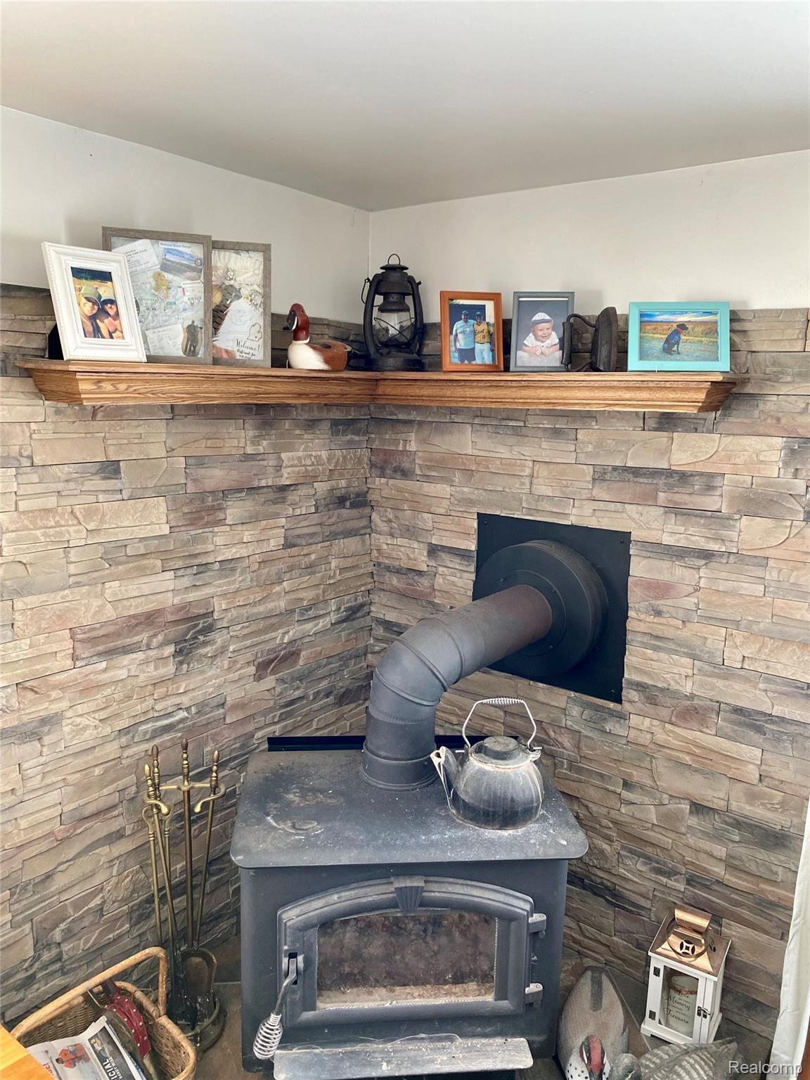 1826 Hadley Road Lapeer, MI 48446 - Photo 28 of 35 fireplace in living room
