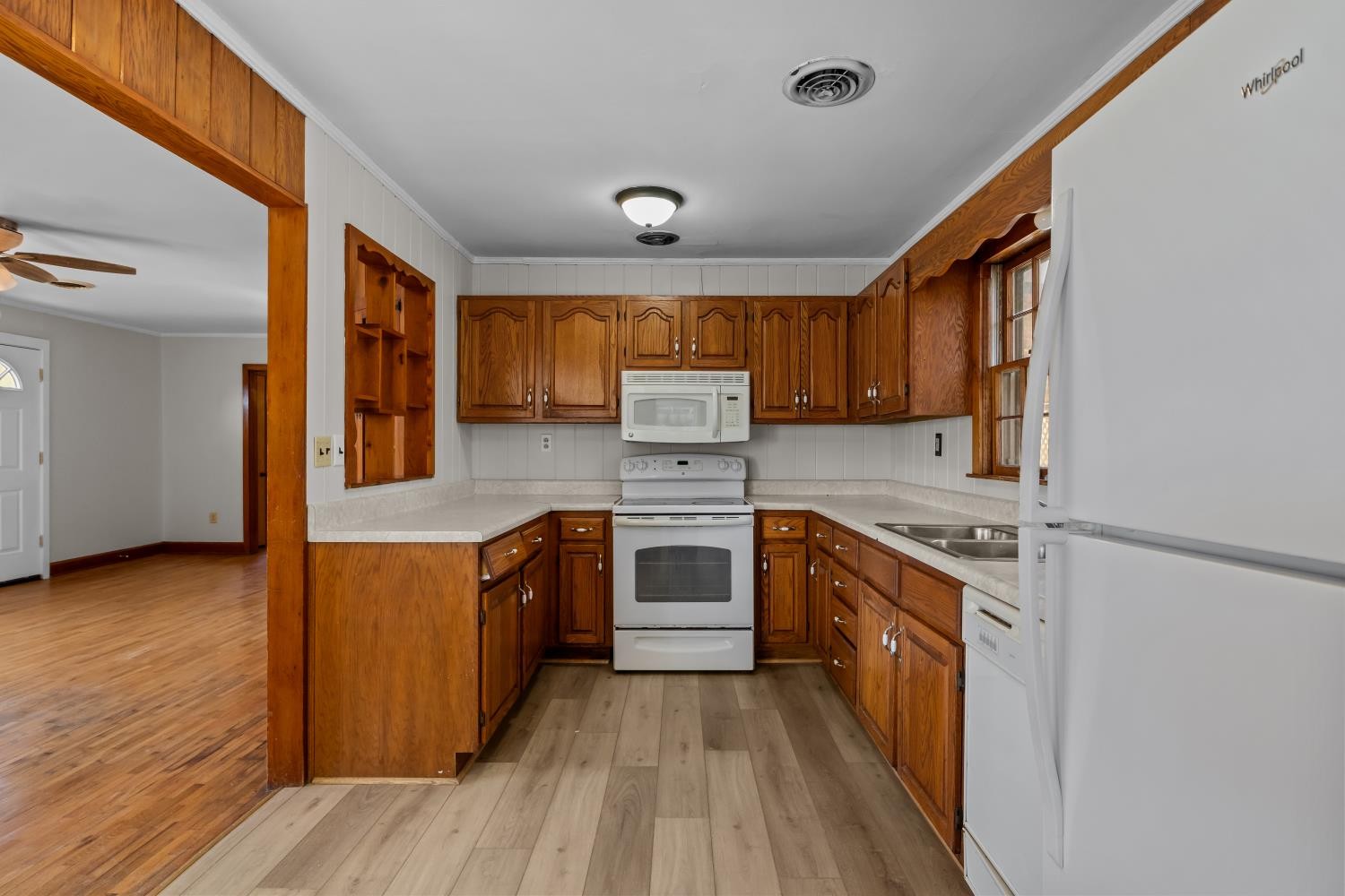 1260 Clydeton Road Waverly, TN 37185 - Photo 14 of 41 a kitchen with stainless steel appliances granite countertop wooden cabinets and a stove top oven