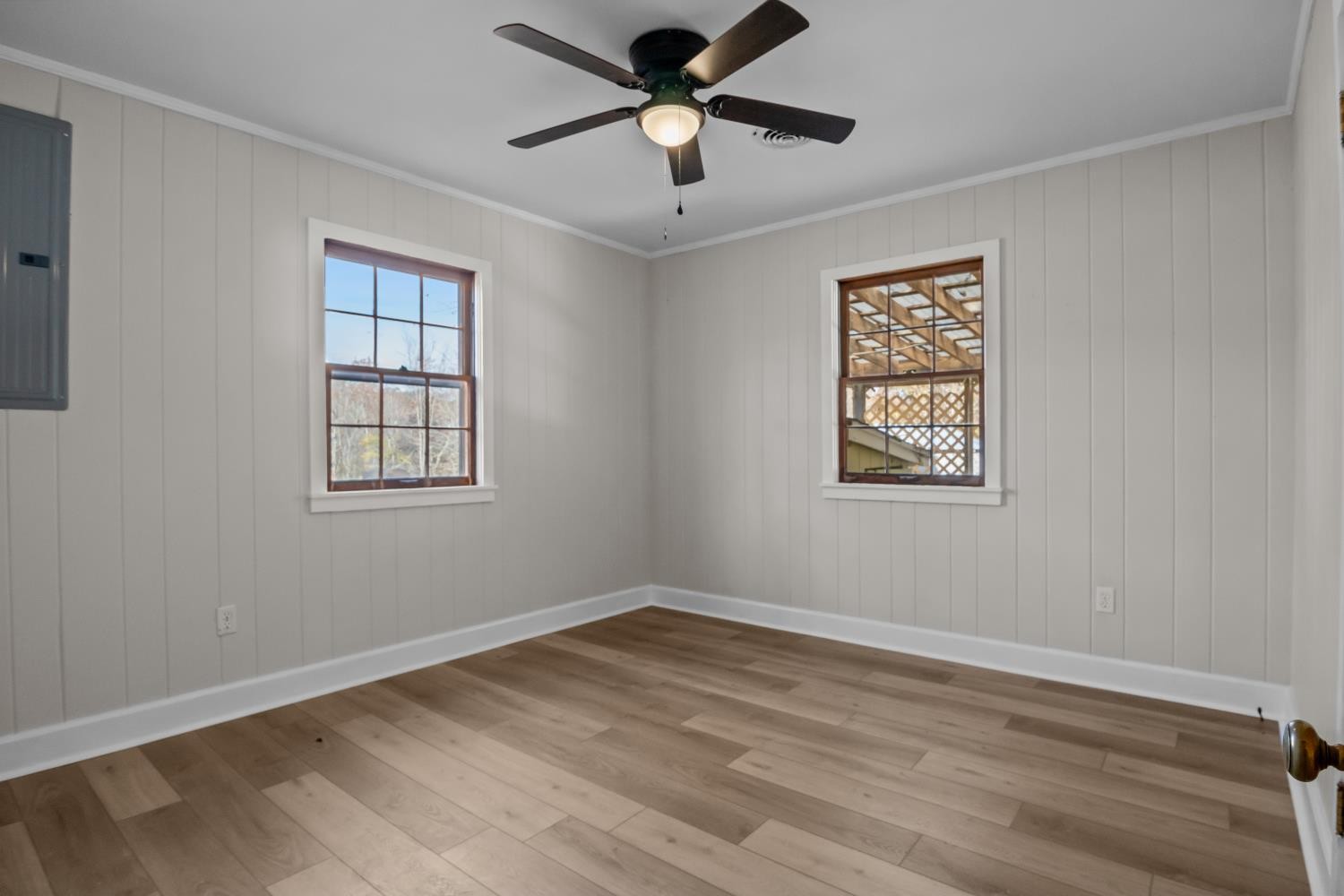 1260 Clydeton Road Waverly, TN 37185 - Photo 16 of 41 a view of empty room with wooden floor and ceiling fan