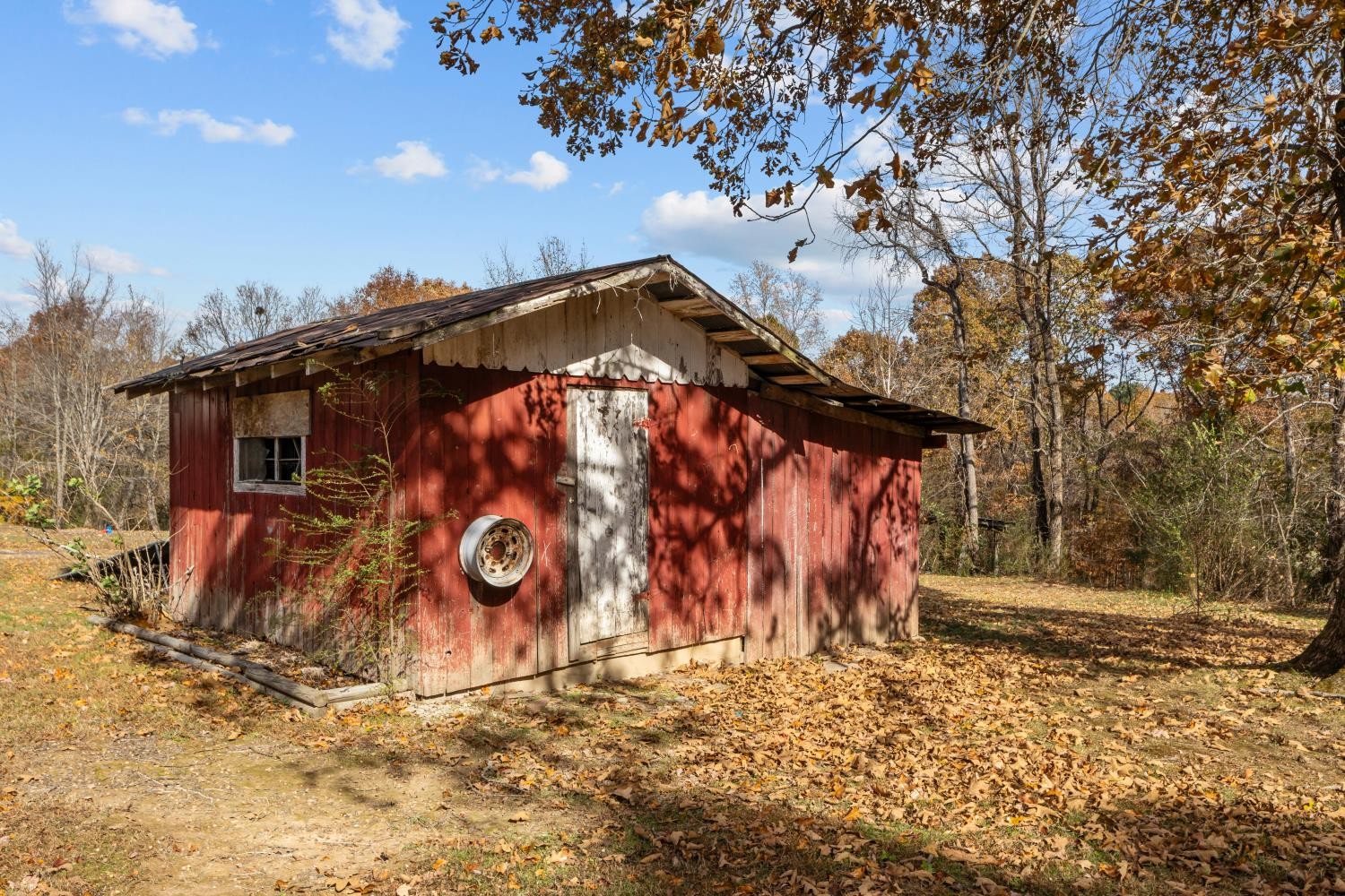 1260 Clydeton Road Waverly, TN 37185 - Photo 33 of 41 a view of a wooden house with a snow on the side of the road