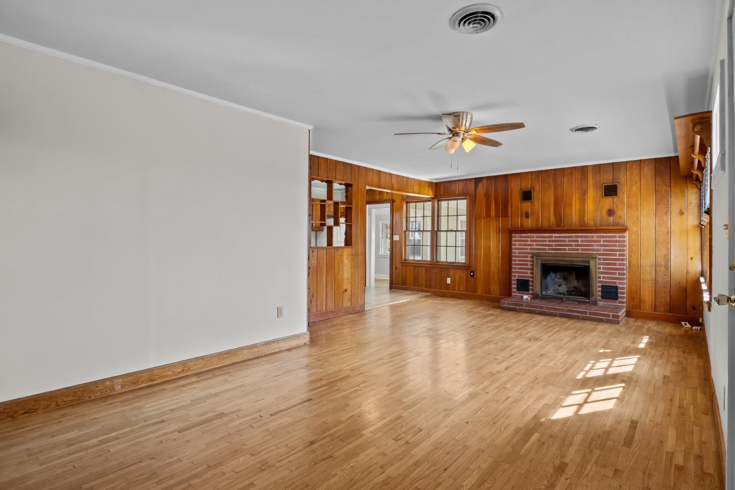 1260 Clydeton Road Waverly, TN 37185 - Photo 6 of 41 wooden floor fireplace and natural light in a room