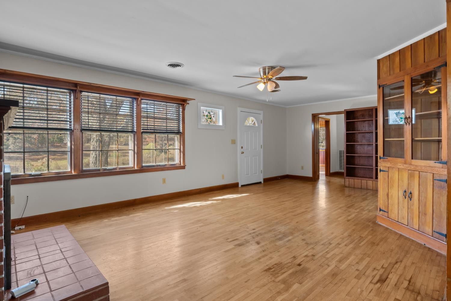 1260 Clydeton Road Waverly, TN 37185 - Photo 7 of 41 wooden floor in an empty room with a window