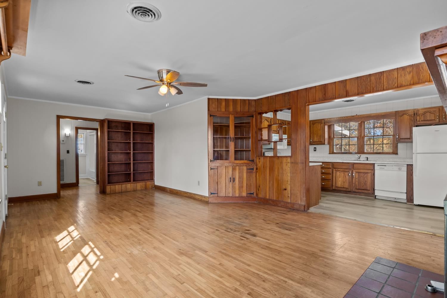 1260 Clydeton Road Waverly, TN 37185 - Photo 8 of 41 an empty room with wooden floor and windows