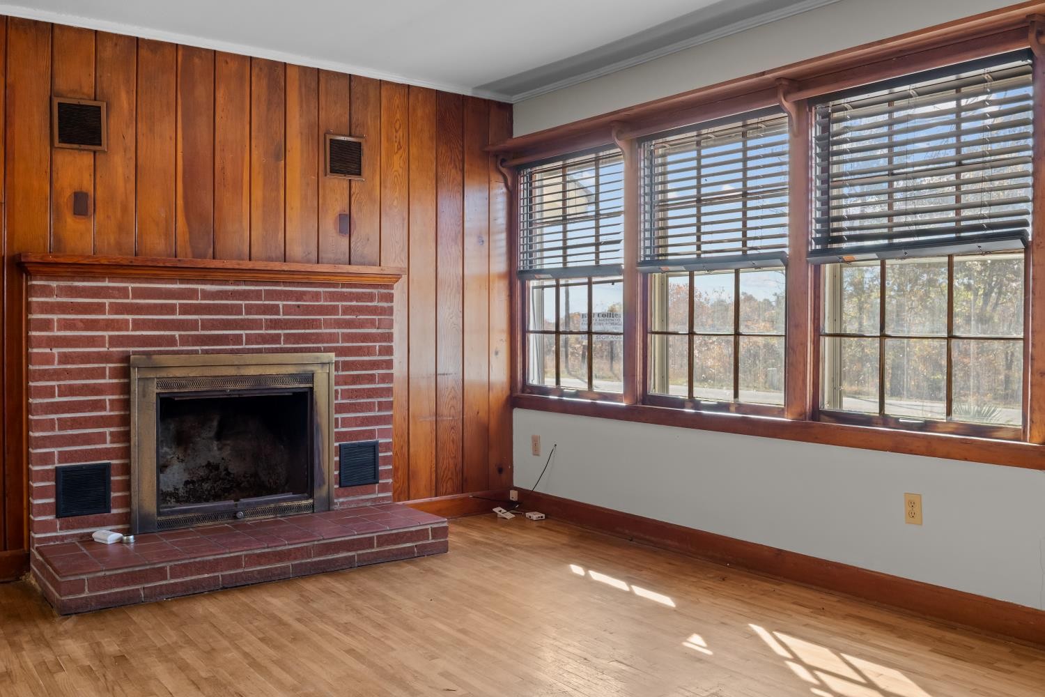 1260 Clydeton Road Waverly, TN 37185 - Photo 10 of 41 a living room with a fireplace and a window