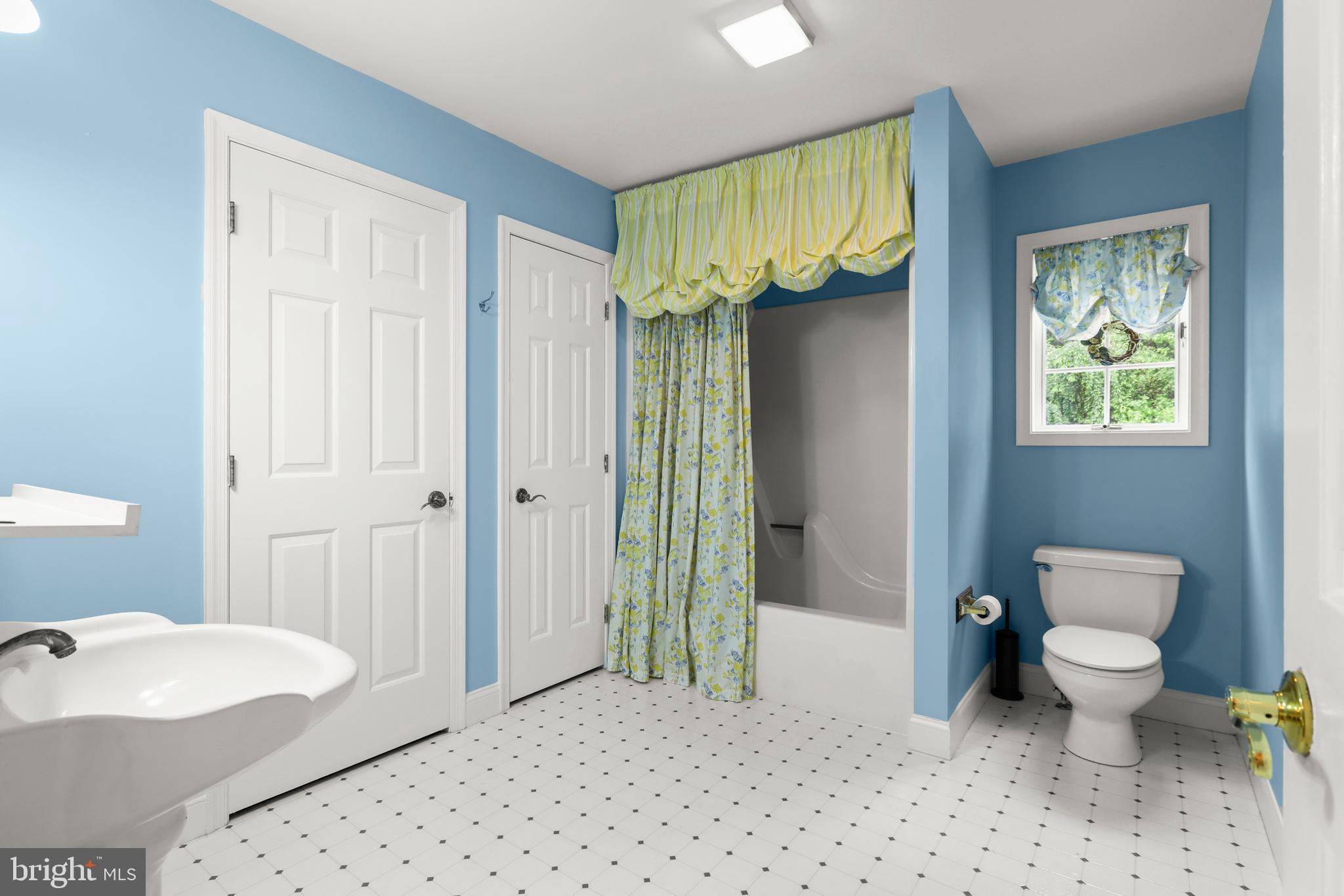 5602 Patterson Road Baldwin, MD 21013 - Photo 74 of 88 a spacious bathroom with a toilet sink and shower