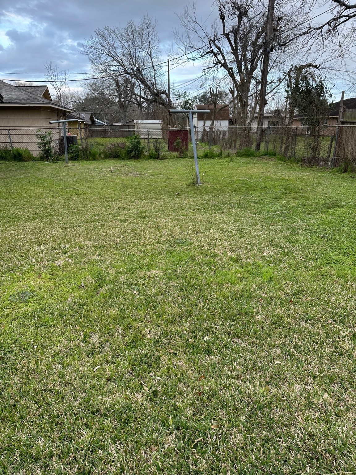6003 Heatherbrook Drive Houston, TX 77085 - Photo 12 of 13 a view of a backyard with large trees