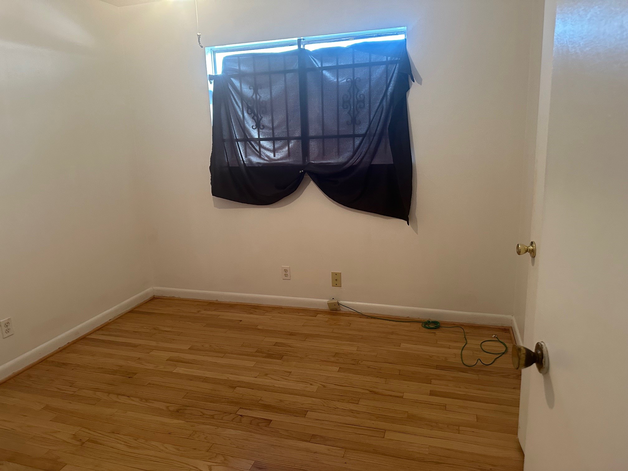 6003 Heatherbrook Drive Houston, TX 77085 - Photo 9 of 13 a room with a wooden floor and a window