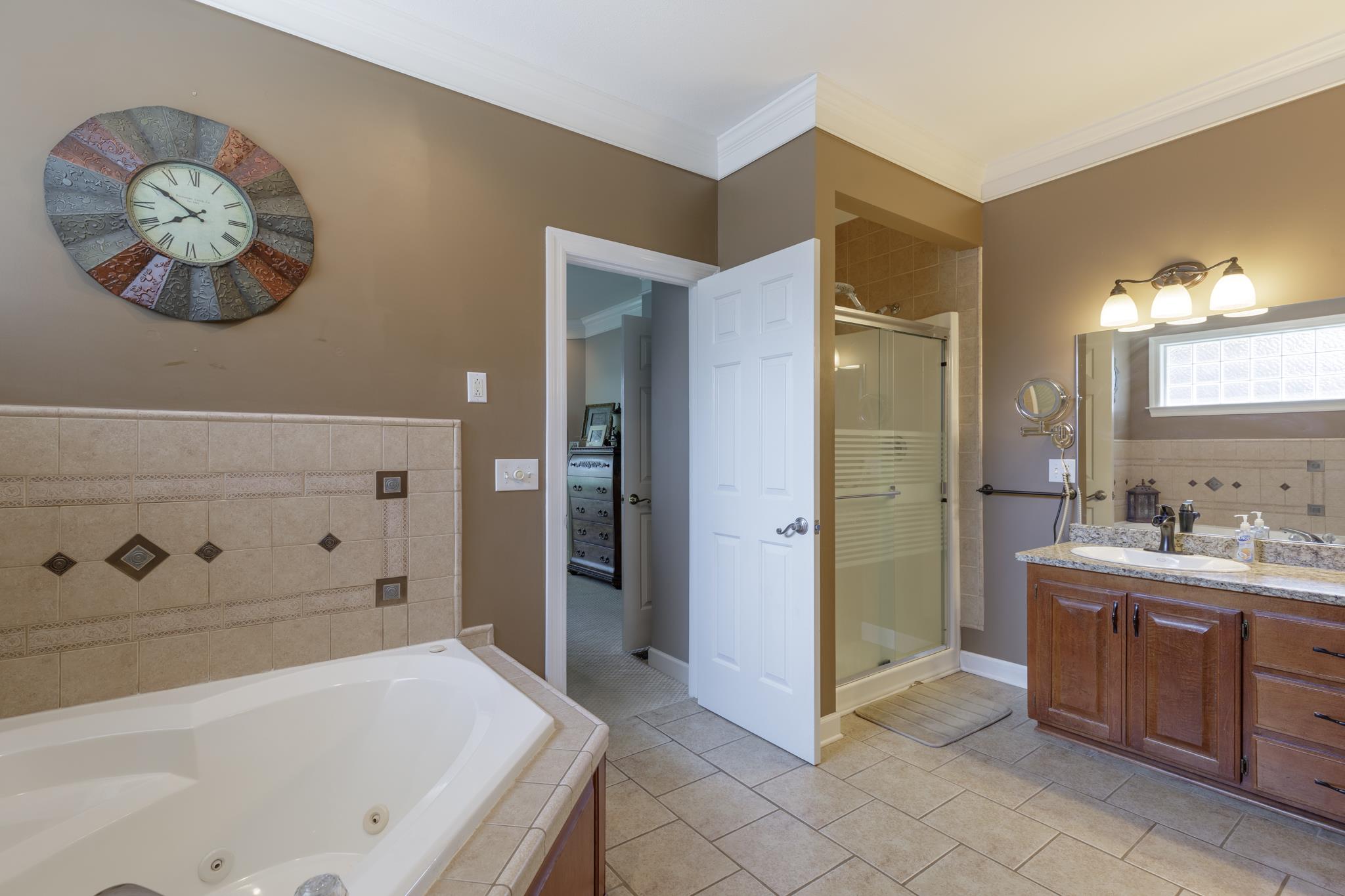 214 Savannah Ridge Murfreesboro, TN 37127 - Photo 12 of 30 This huge master bathroom has tile floors, double vanity and separate shower/tub! 214 Savannah Ridge, Murfreesboro, TN 37127