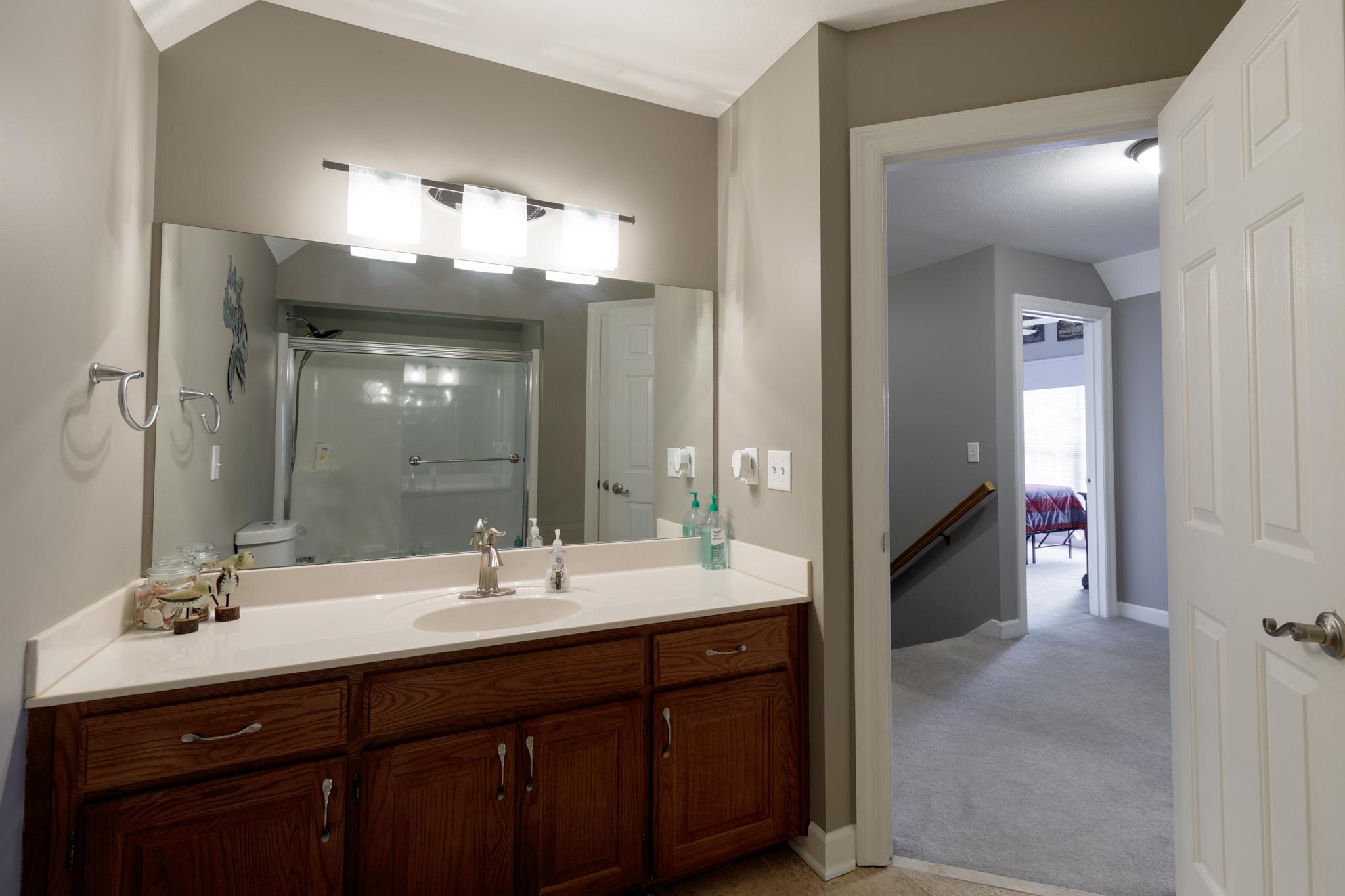 214 Savannah Ridge Murfreesboro, TN 37127 - Photo 18 of 30 Upstairs guest bathroom has a single vanity with updated light fixture and faucet! 214 Savannah Ridge, Murfreesboro, TN 37127