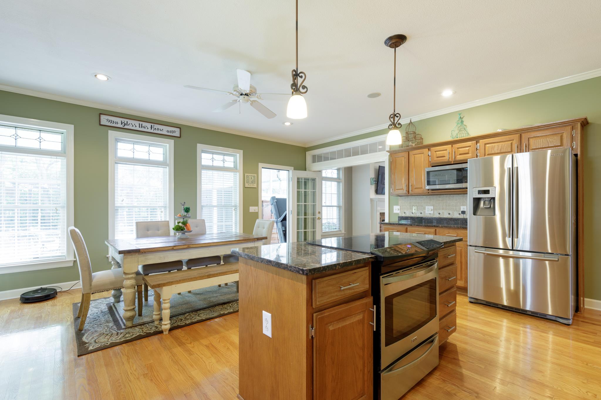 214 Savannah Ridge Murfreesboro, TN 37127 - Photo 7 of 30 This kitchen is a chef's dream! Stainless steel appliances, tile backsplash, granite counter tops and island with stove! 214 Savannah Ridge, Murfreesboro, TN 37127