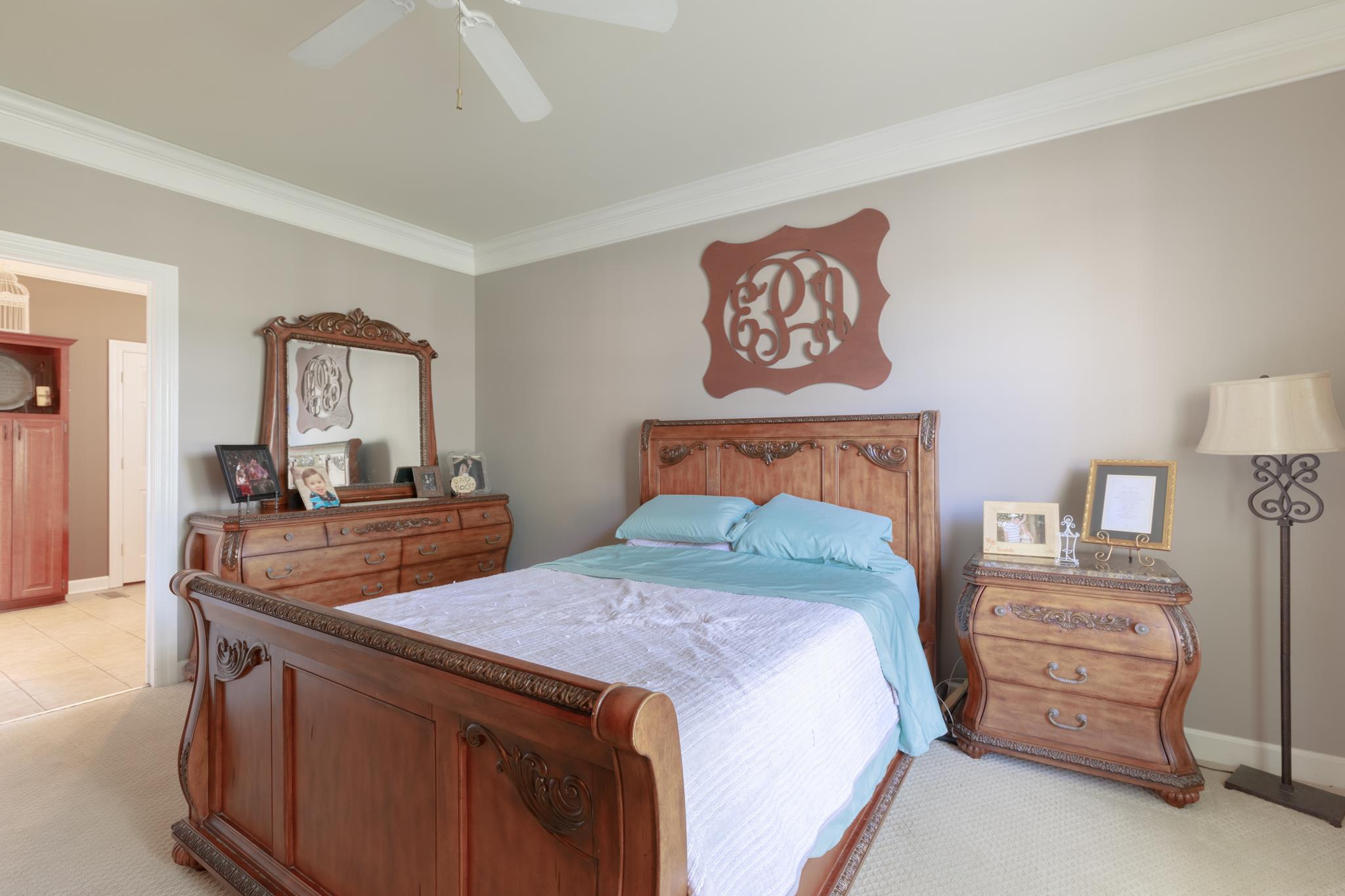 214 Savannah Ridge Murfreesboro, TN 37127 - Photo 10 of 30 Master suite is located on the main level! It has neutral colors, gas fireplace, ceiling fan and extra trim work! 214 Savannah Ridge, Murfreesboro, TN 37127