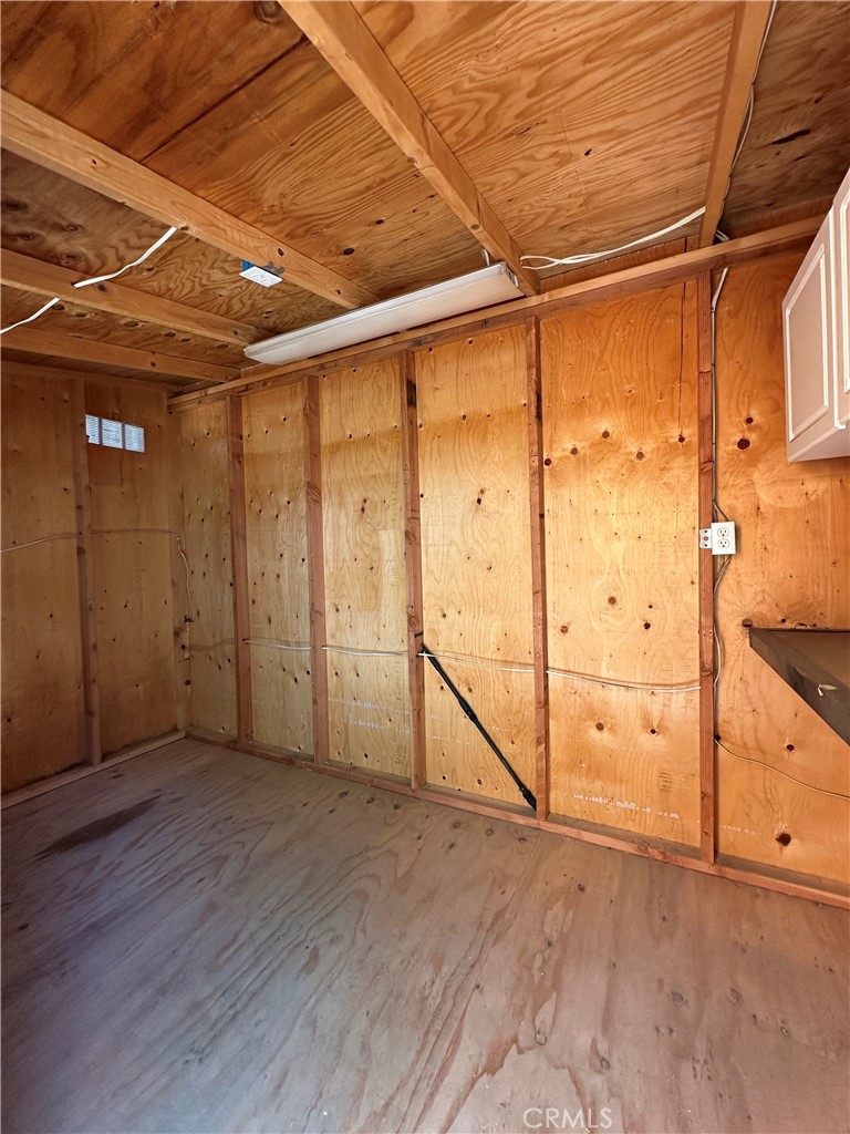 6707 Rycroft Drive Riverside, CA 92506 - Photo 16 of 41 an empty room with wooden floor and windows