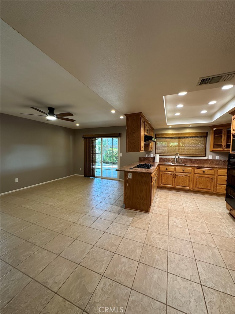 6707 Rycroft Drive Riverside, CA 92506 - Photo 24 of 41 a large kitchen with stainless steel appliances a large counter top