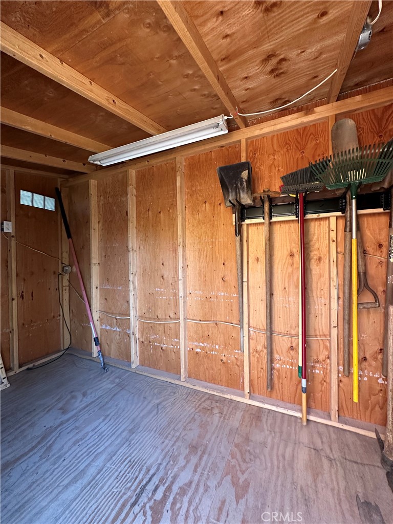 6707 Rycroft Drive Riverside, CA 92506 - Photo 26 of 41 a view of an empty room with wooden floor and stairs