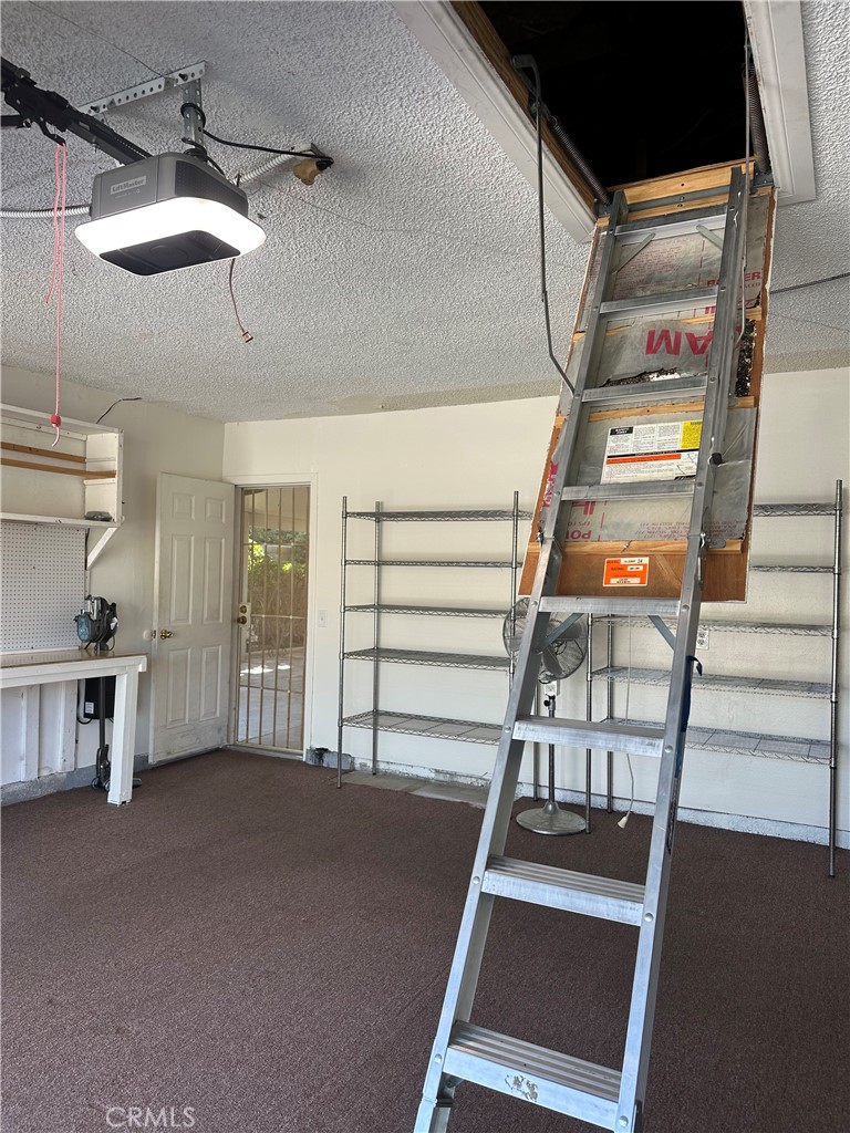 6707 Rycroft Drive Riverside, CA 92506 - Photo 39 of 41 a view of a hallway with staircase