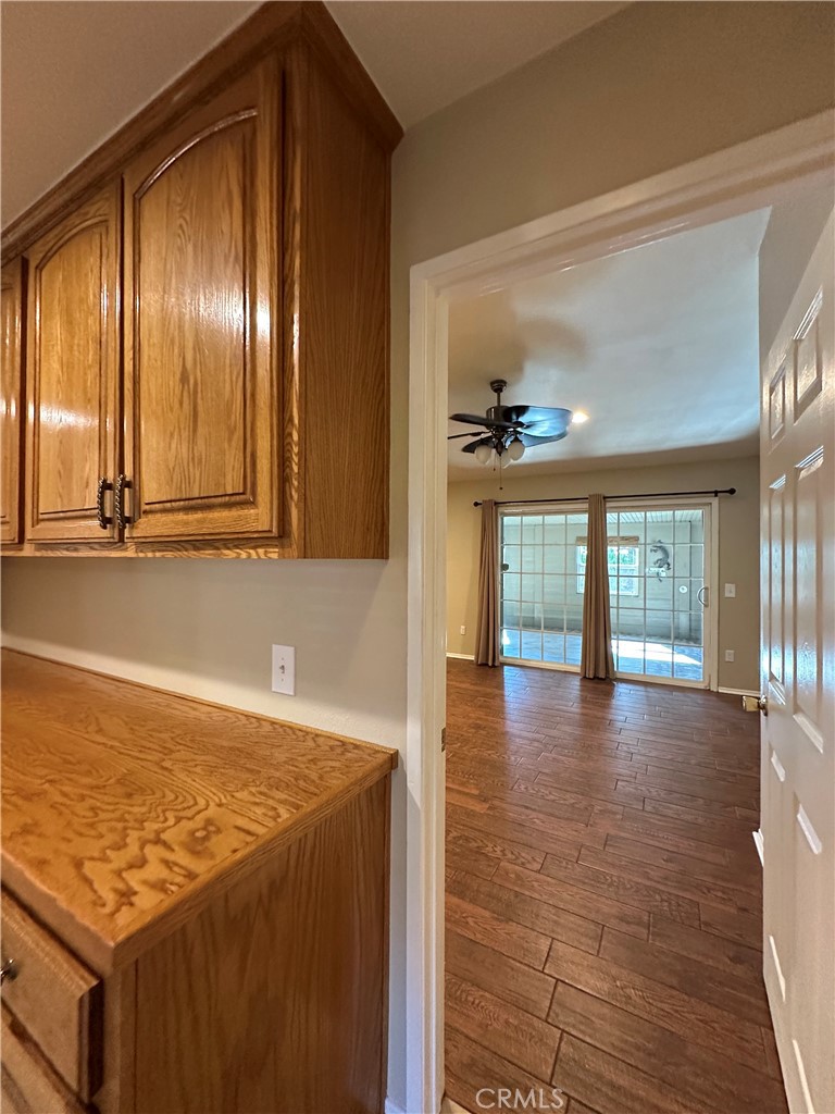 6707 Rycroft Drive Riverside, CA 92506 - Photo 9 of 41 a view of an empty room with wooden floor and a window