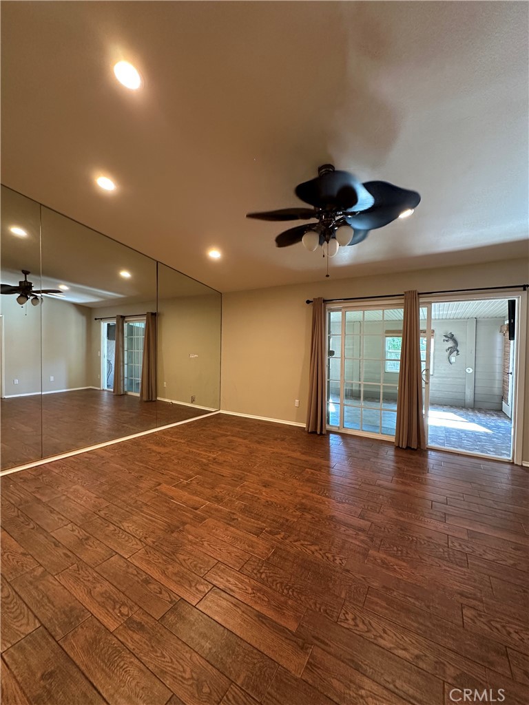 6707 Rycroft Drive Riverside, CA 92506 - Photo 10 of 41 a view of empty room with wooden floor and fan