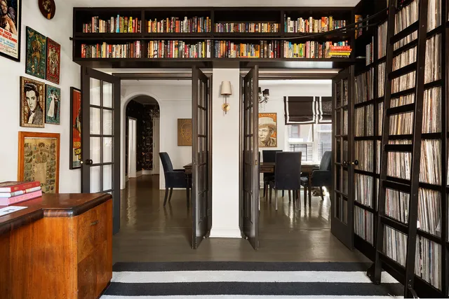 a view of livingroom with furniture and book shelf
