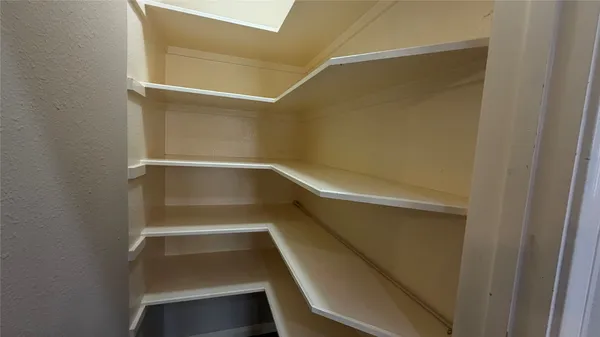 a empty closet with white paint