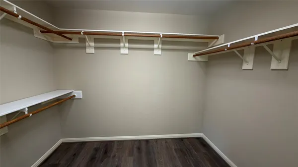 a view of an empty walk in closet