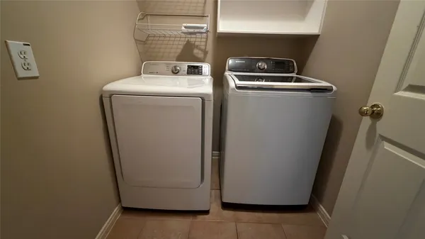 a utility room with dryer and washer