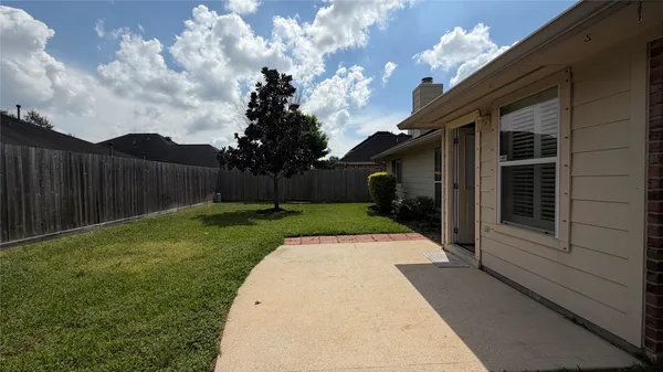 a view of backyard with green space