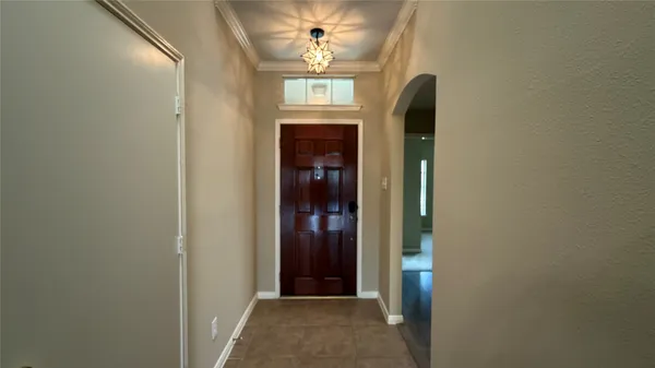 a view of a hallway to rooms