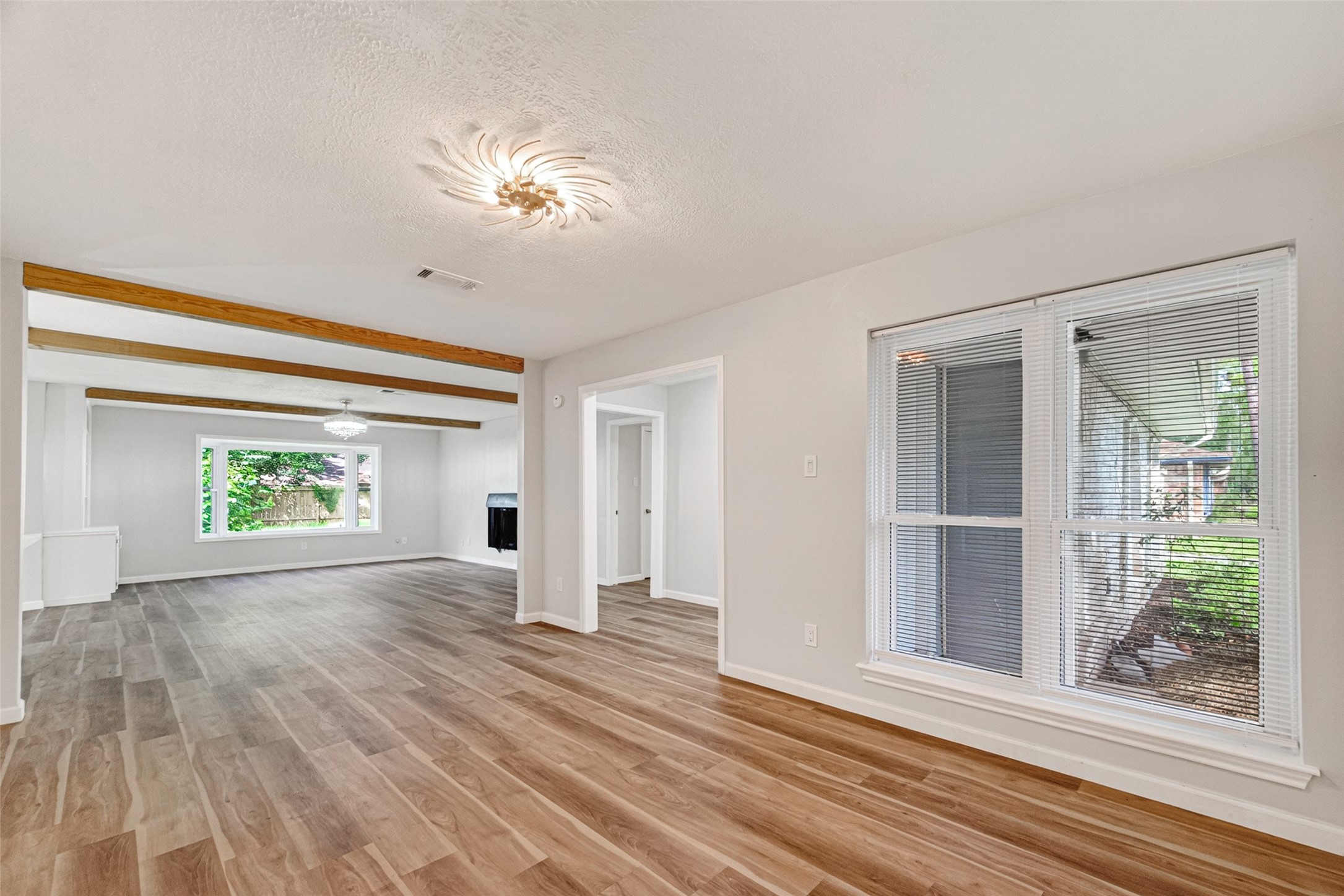 25503 Foxbriar Lane Spring, TX 77373 - Photo 9 of 45 a view of a livingroom with wooden floor and a large window