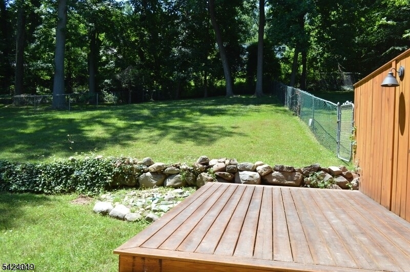 89 Forsythia Lane, Unit A Paramus, NJ 07652 - Photo 7 of 12 a view of yard with swimming pool